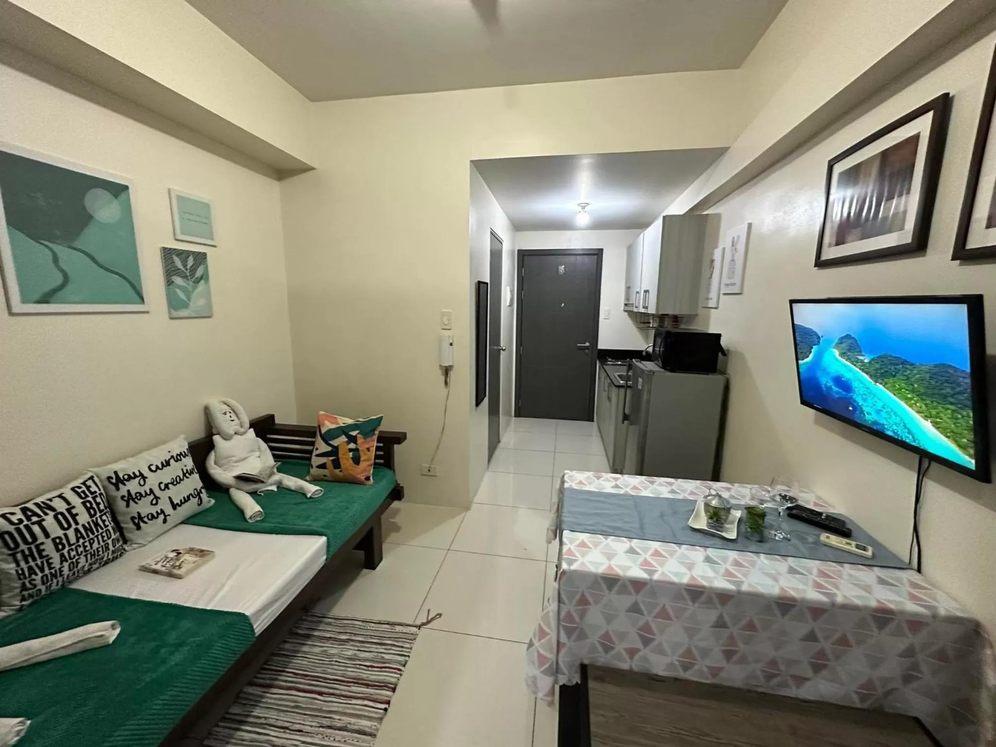 Bed in Green Residences Stays by PBYY