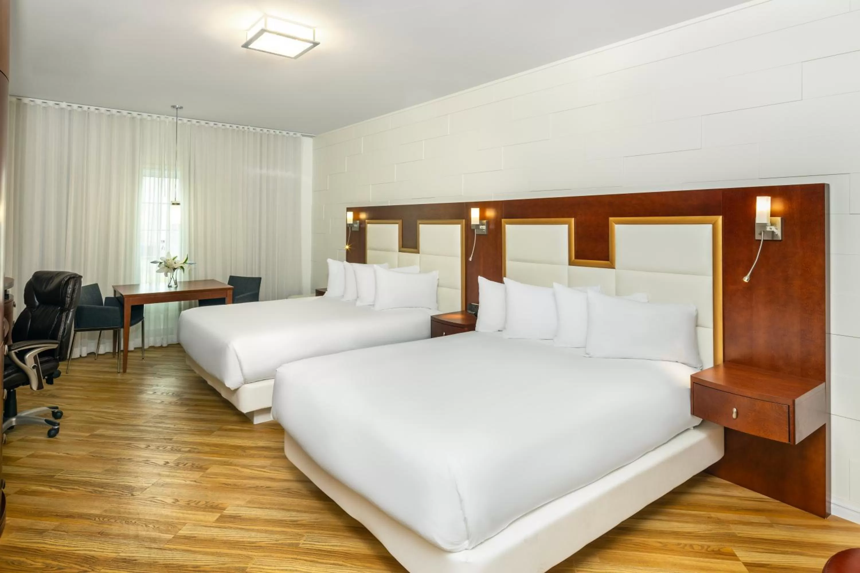 Bed in Les Suites de Laviolette, an Ascend Collection Hotel