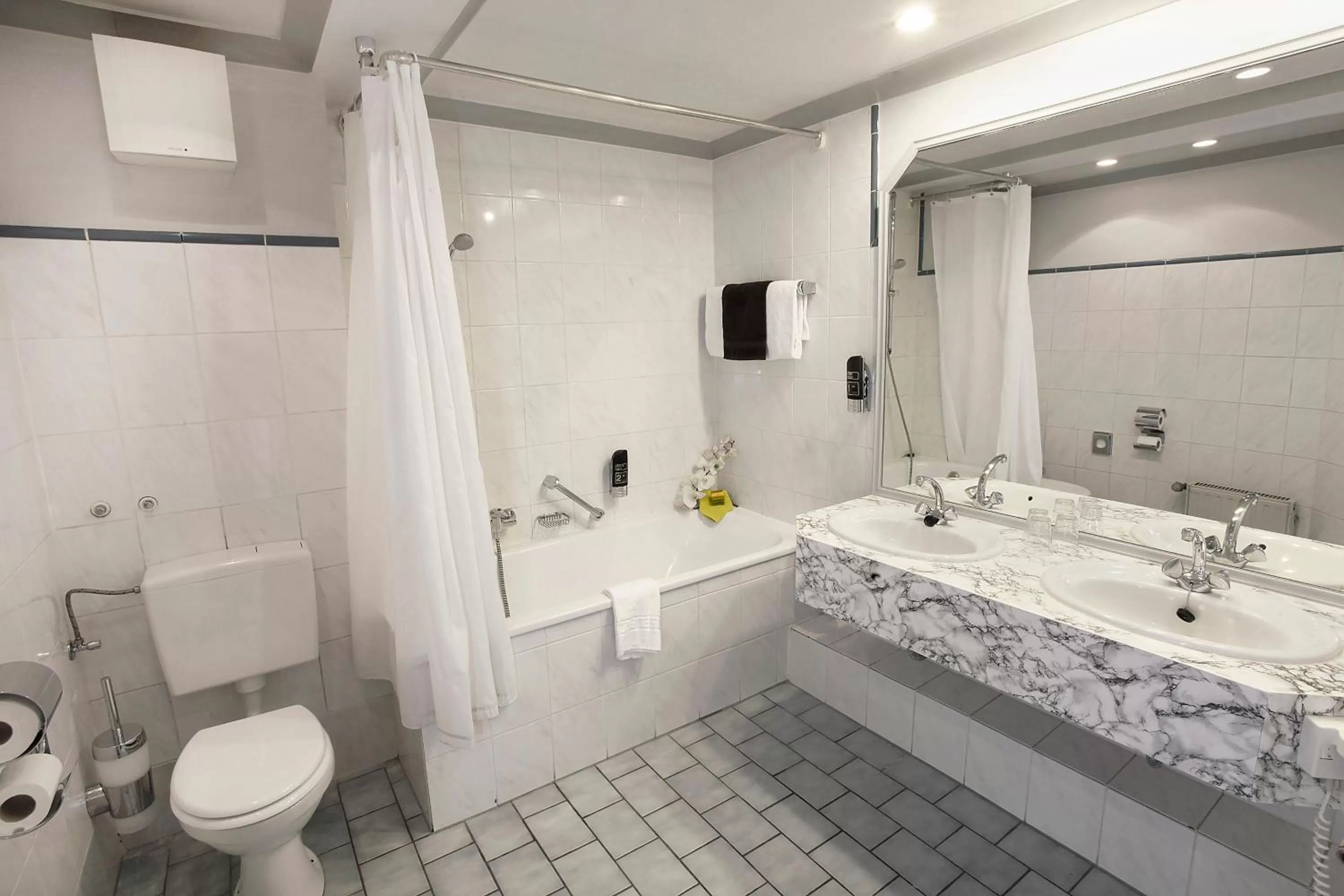 Bathroom in INA Hotel Royal