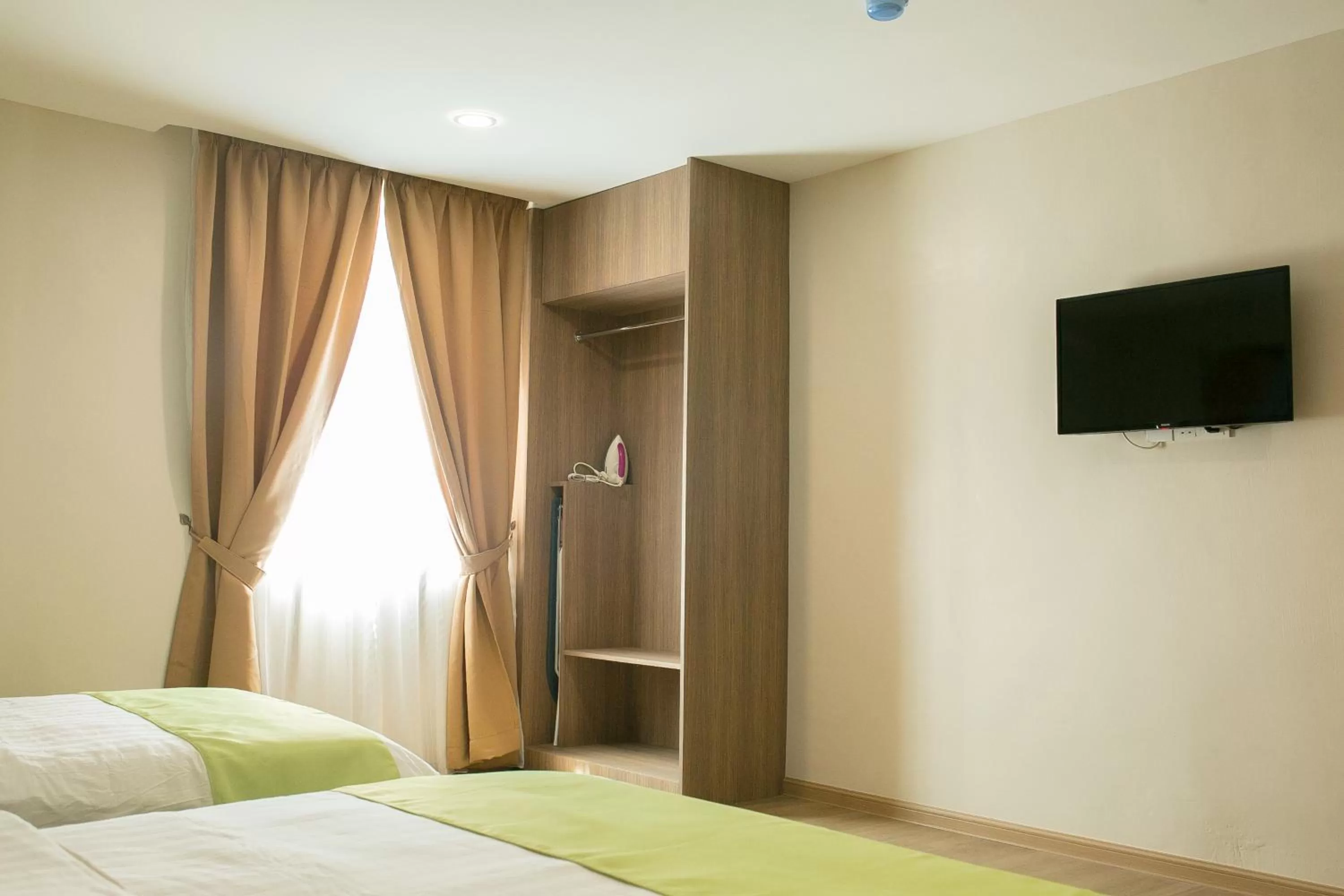 Bedroom, TV/Entertainment Center in Savana Hotel & Serviced Apartments