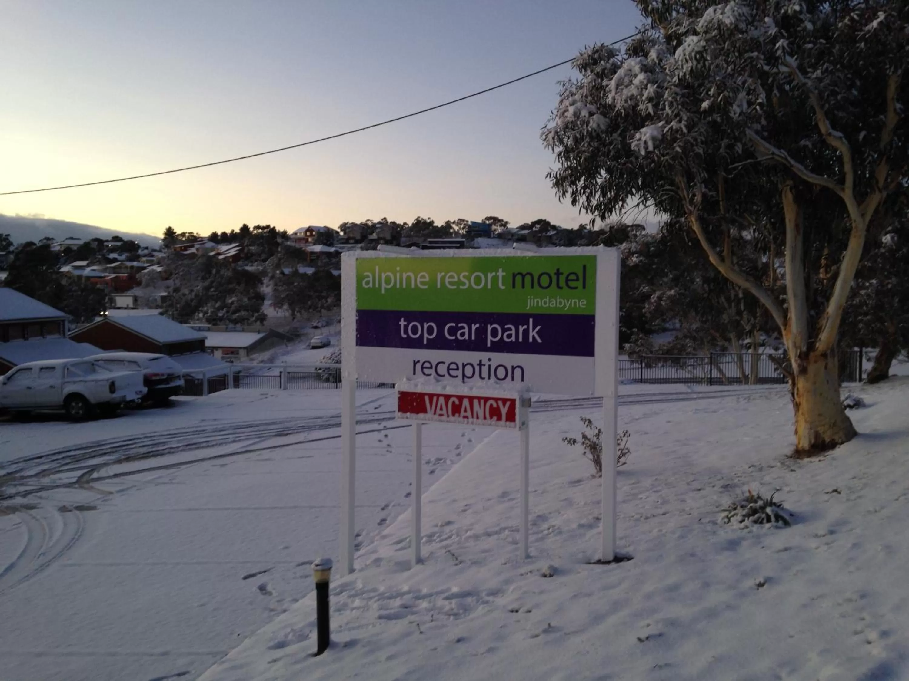 Property logo or sign in Alpine Resort Motel