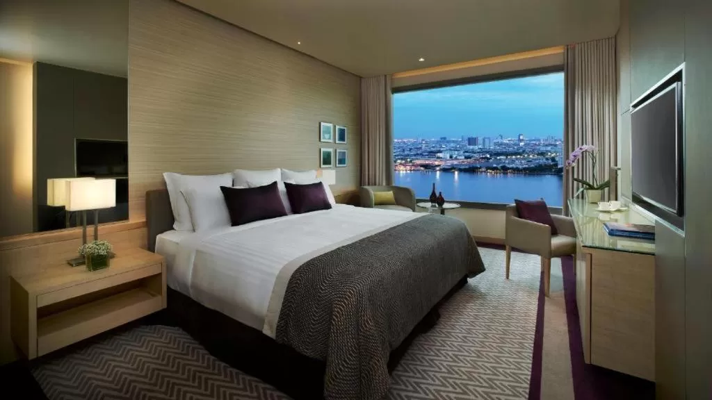 Bed in Avani Plus Riverside Bangkok Hotel