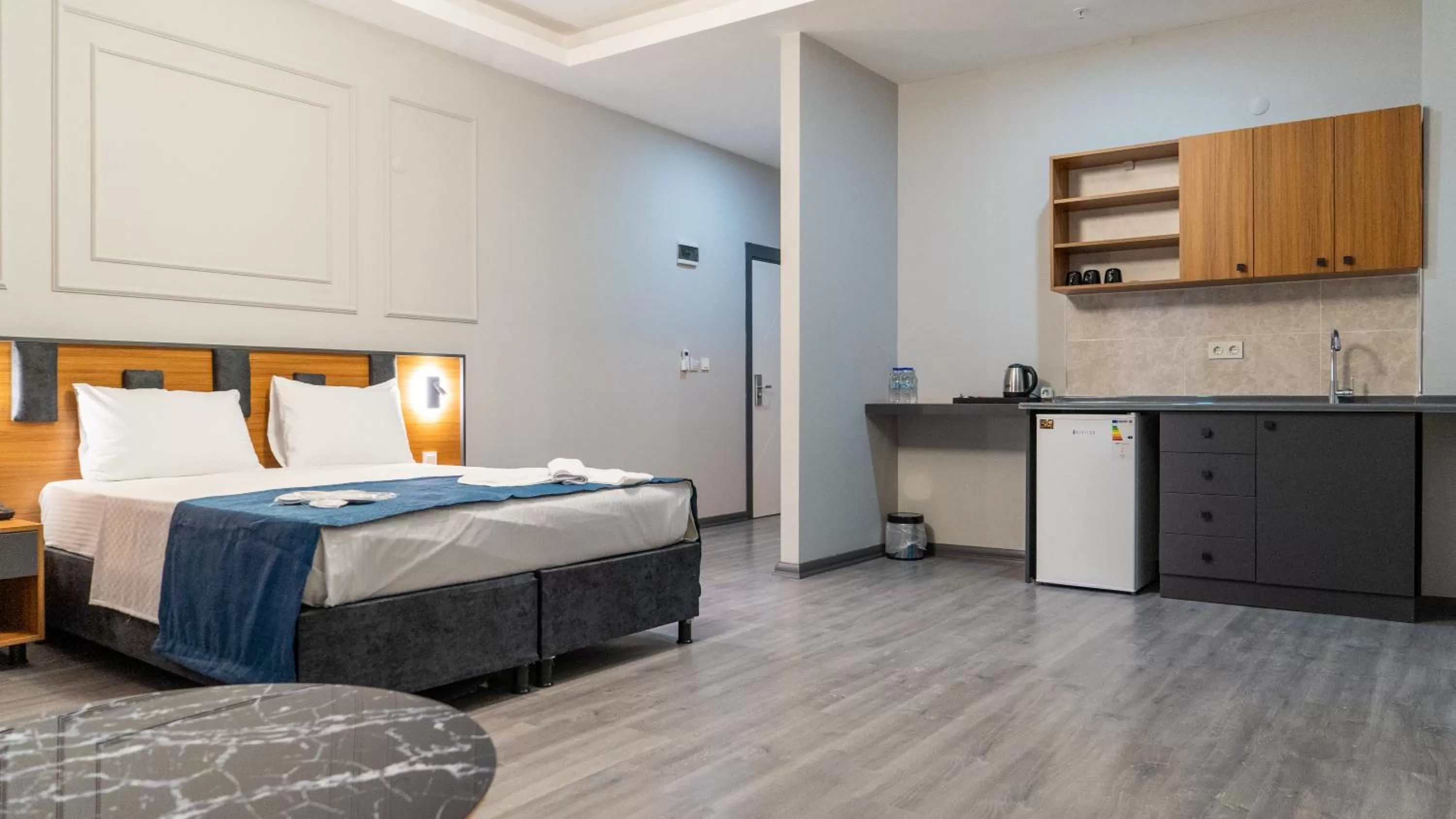 Kitchen or kitchenette, Bed in GRAND MOON HOTEL