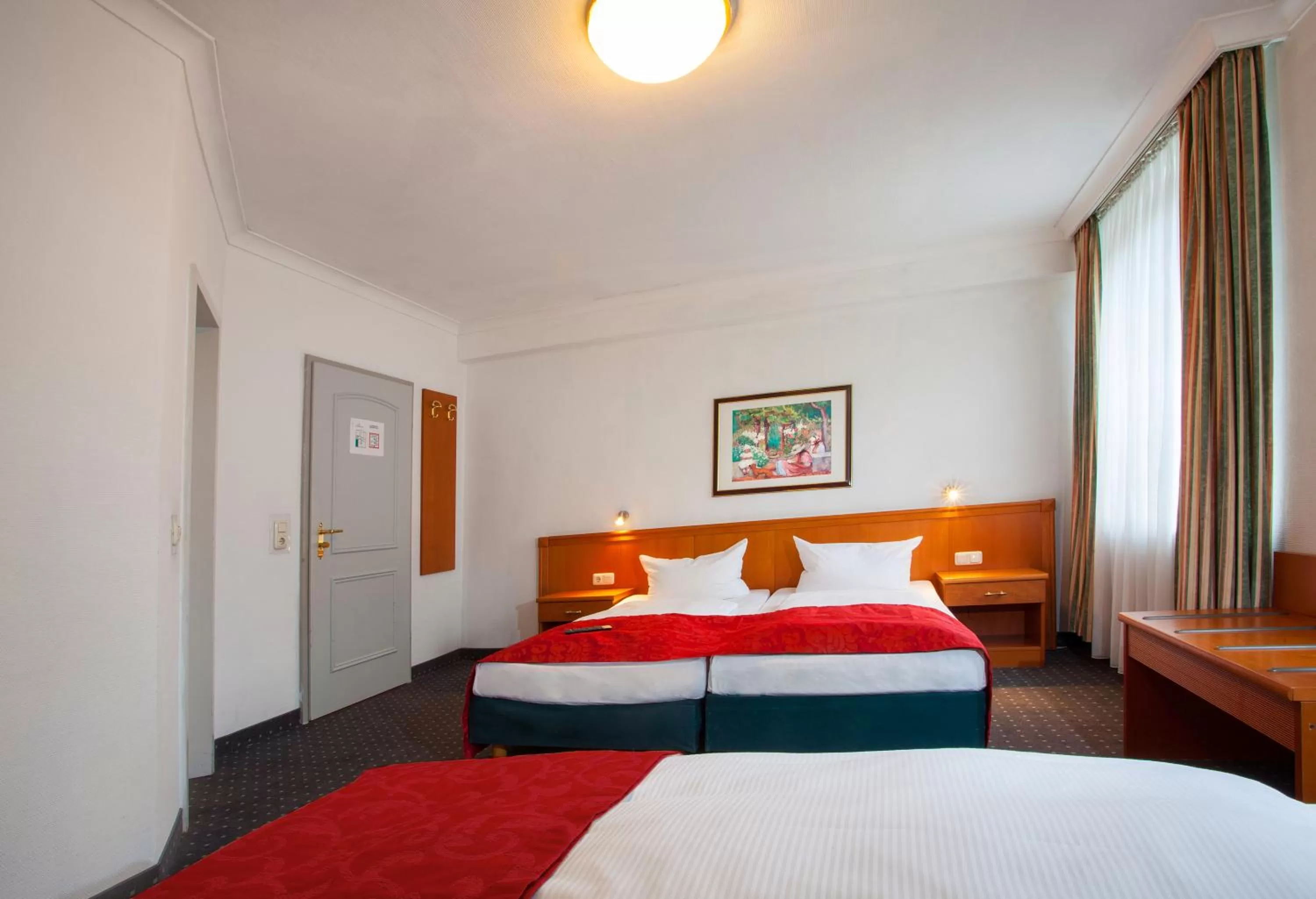 Bed in INA Hotel Royal