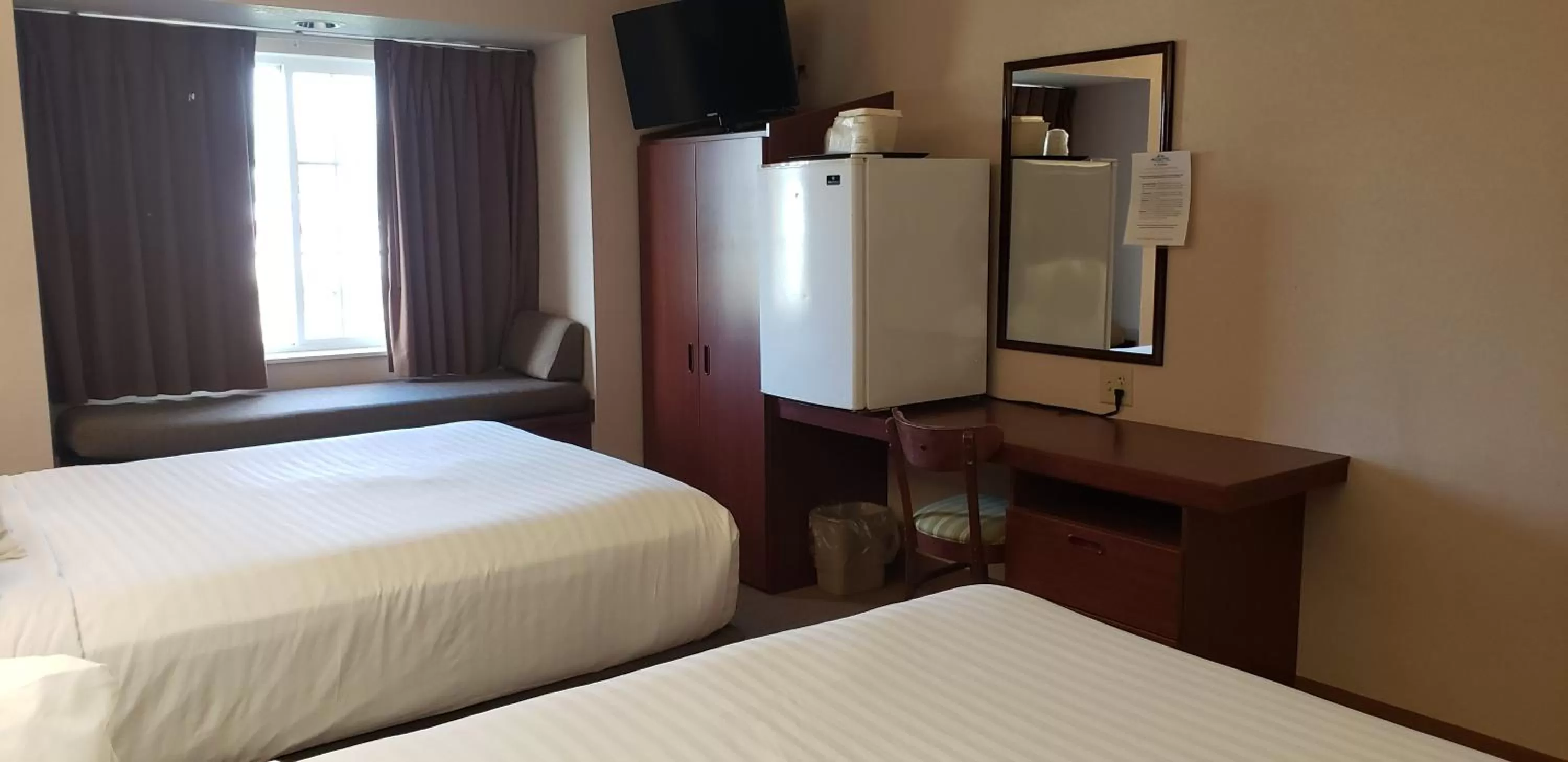 Bed in Microtel Inn & Suites by Wyndham Wellsville