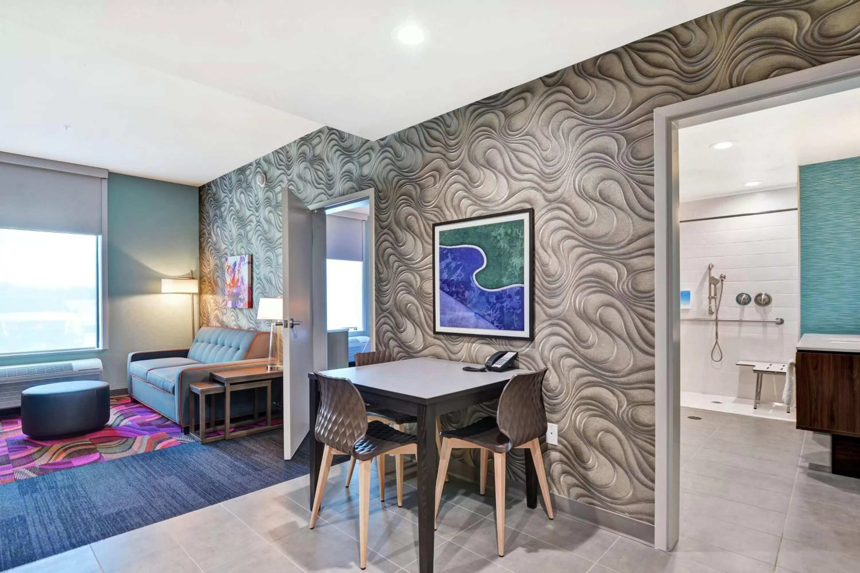 Living room, Bed in Home2 Suites By Hilton McKinney