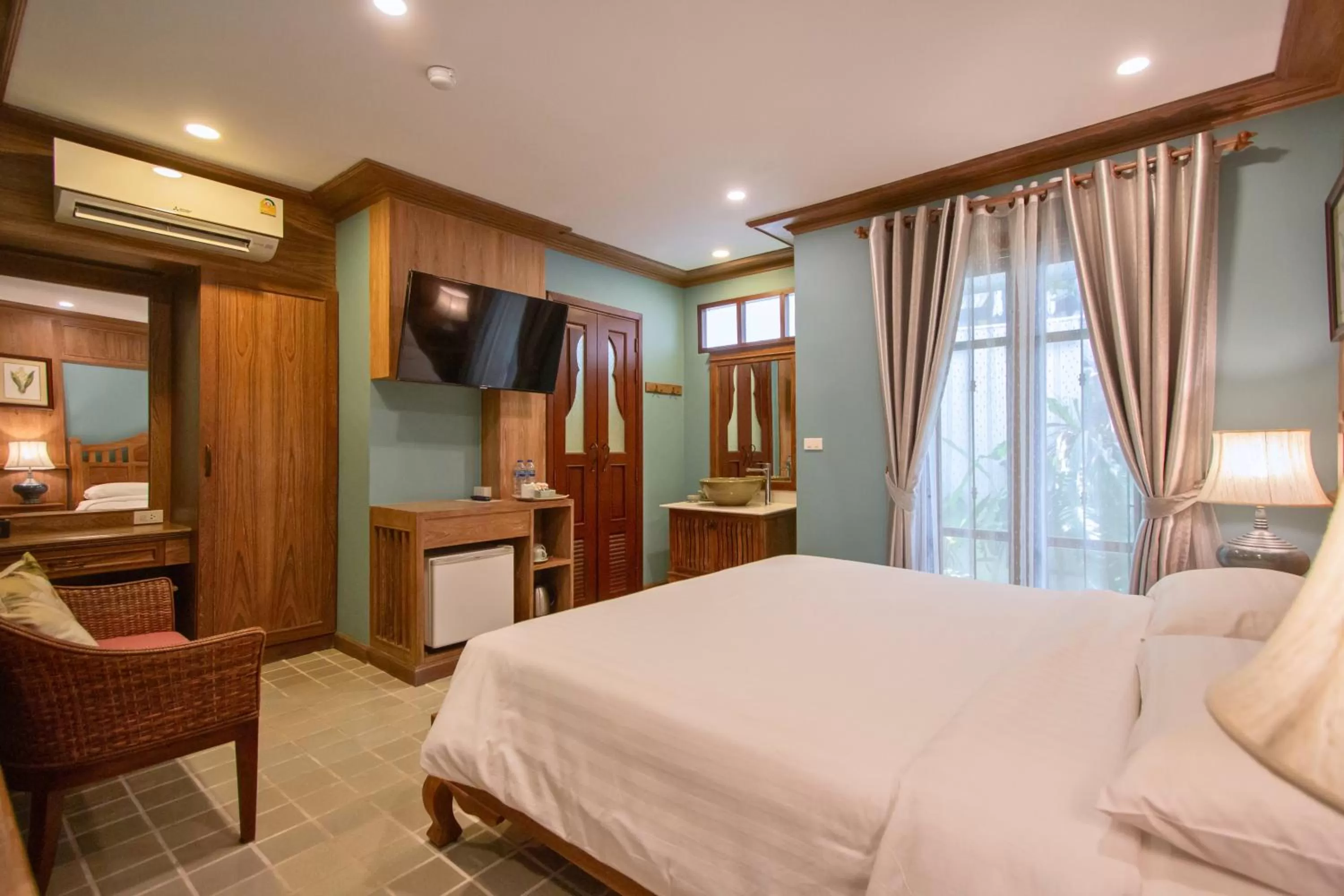 Bed in Rich Garden House Hotel