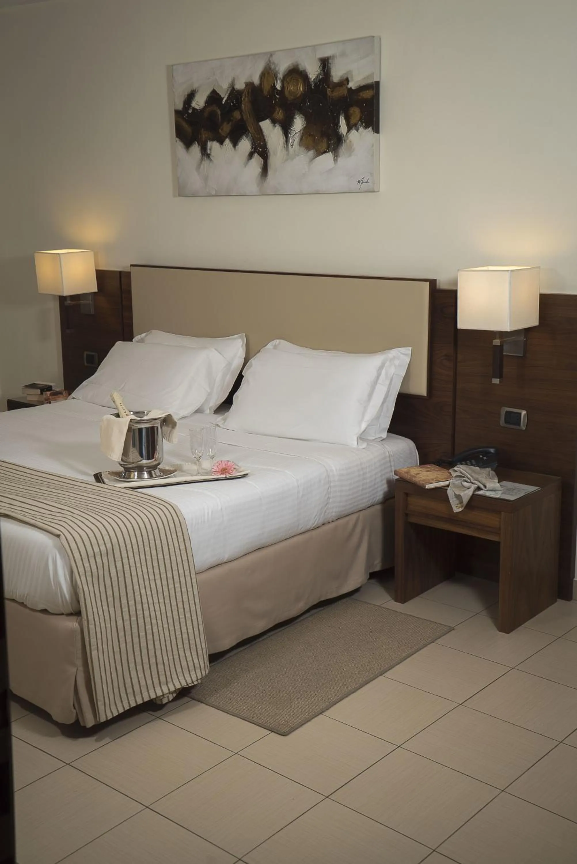 Bed in Suites & Residence Hotel