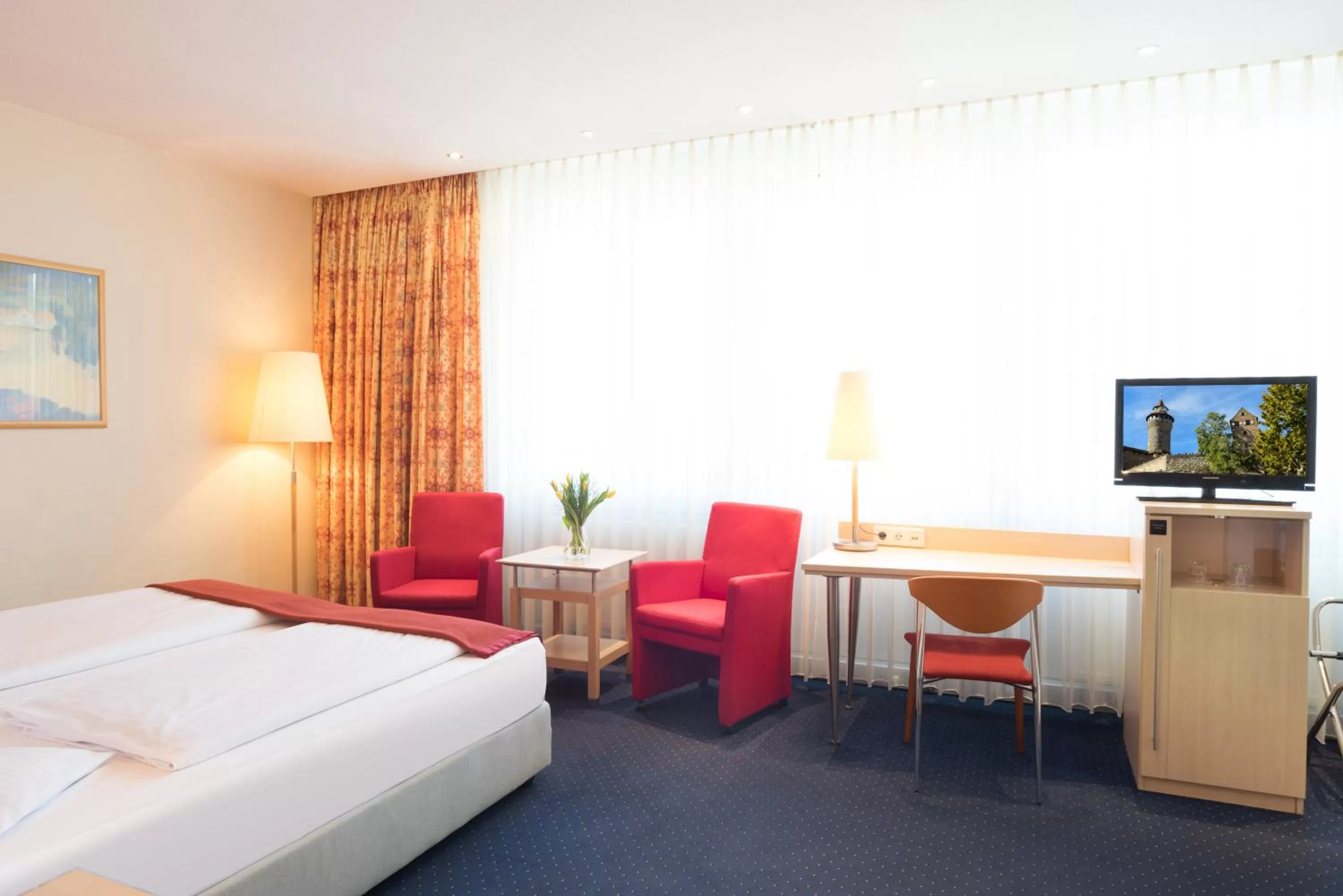 Photo of the whole room, Bed in Ringhotel Loew's Merkur