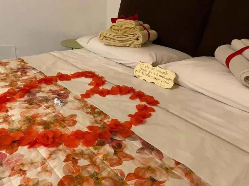 Bed in Alla dimora di Chiara Suite and Rooms