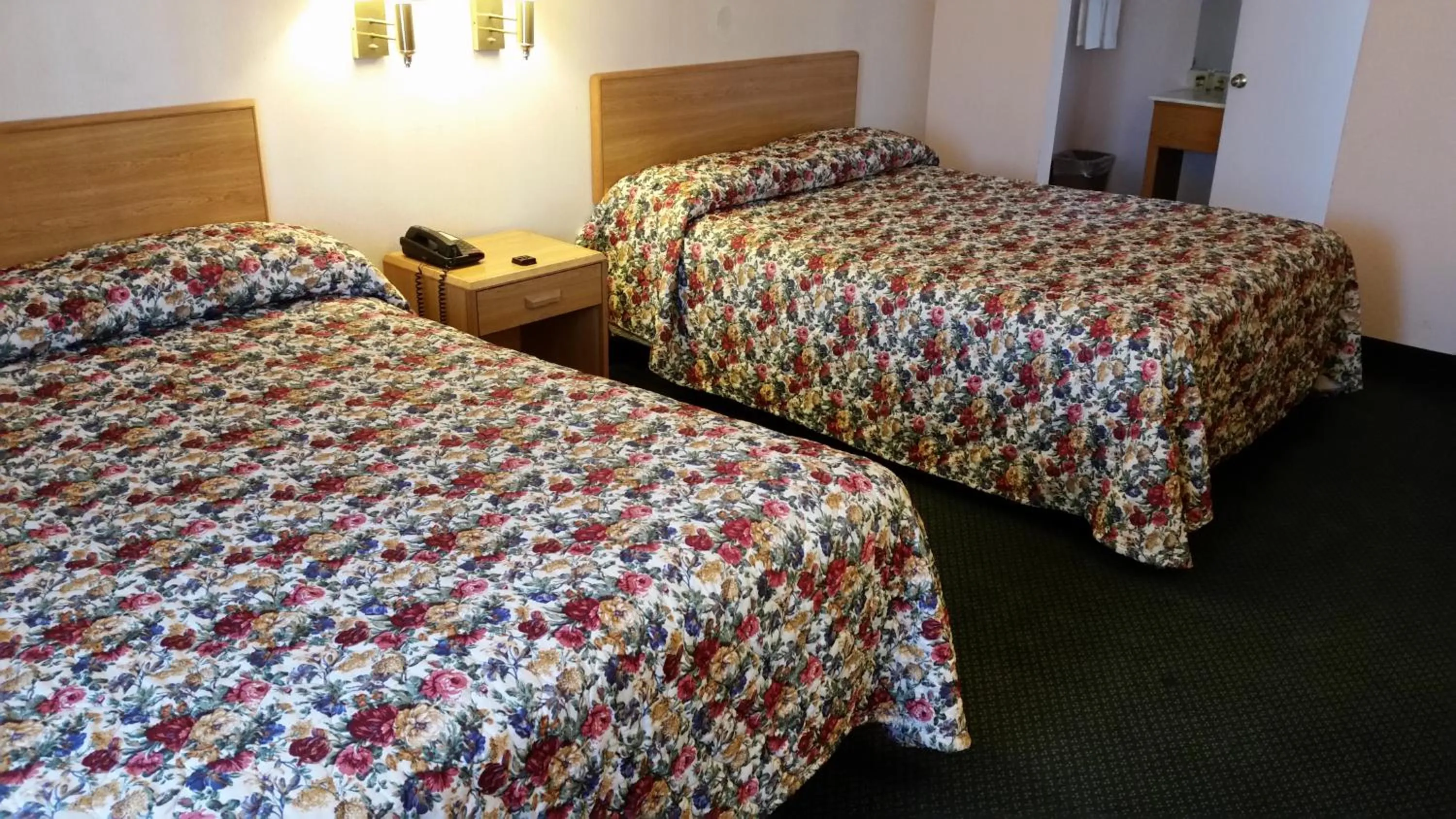 Bed in Economy Inn Motel