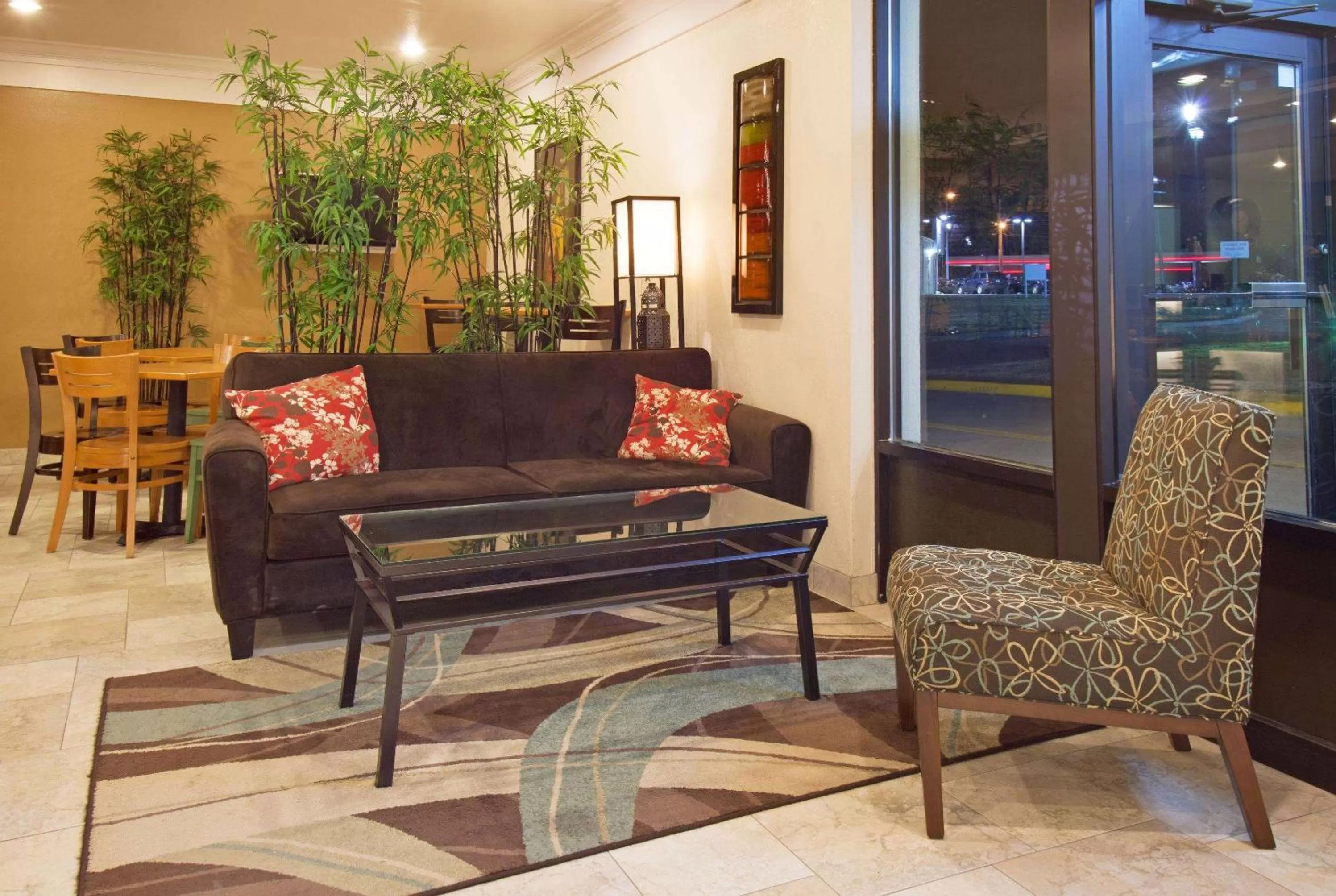 Seating area in AmericInn by Wyndham Johnston Des Moines