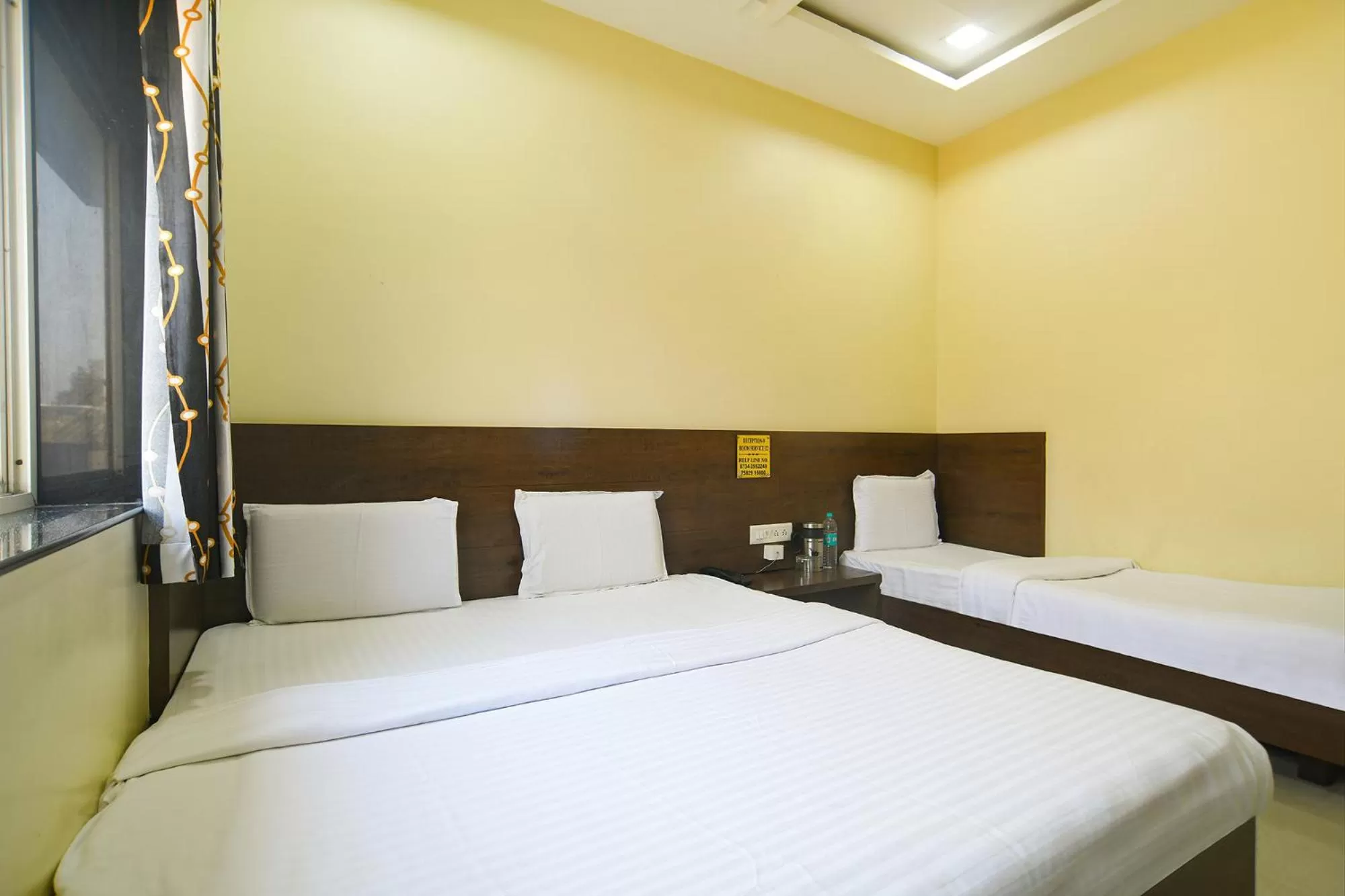 Bed in FabHotel Satyug Jaisinghpura