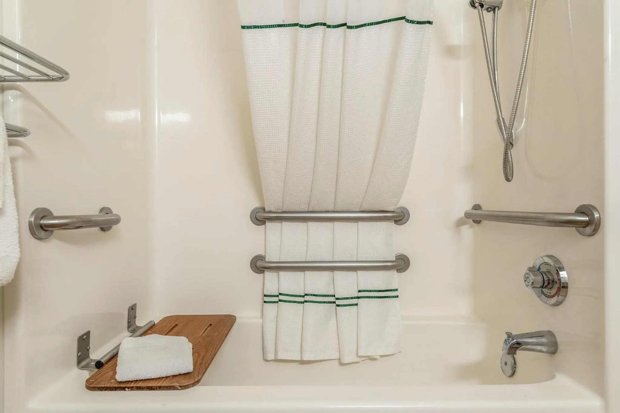 Bathroom in HomeTowne Studios by Red Roof Raleigh – Durham