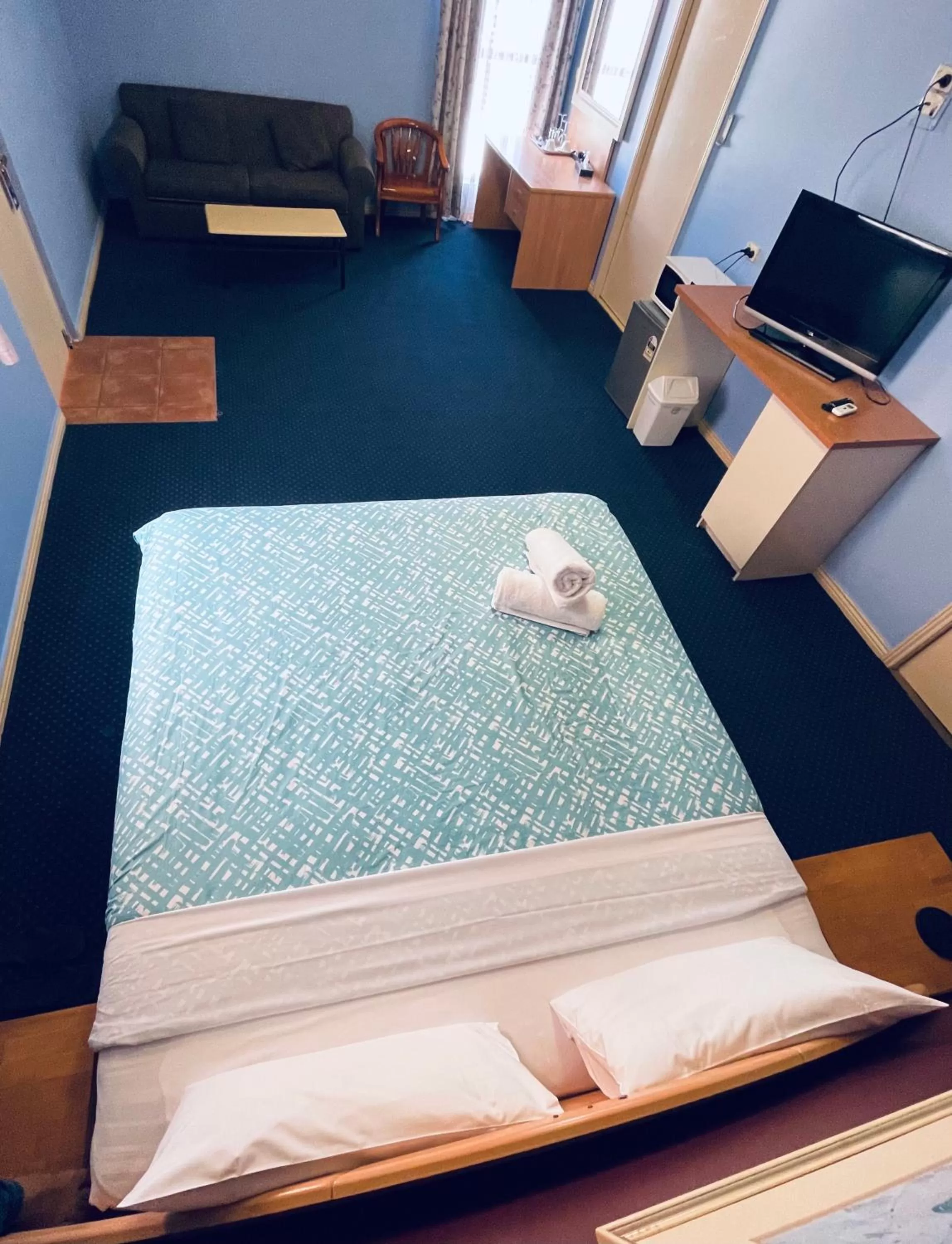 Bed in City East Motel