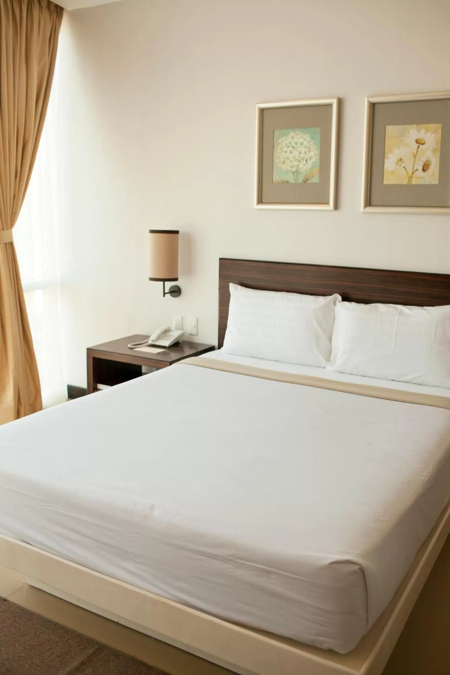 Bed in D'Hotel & Suites