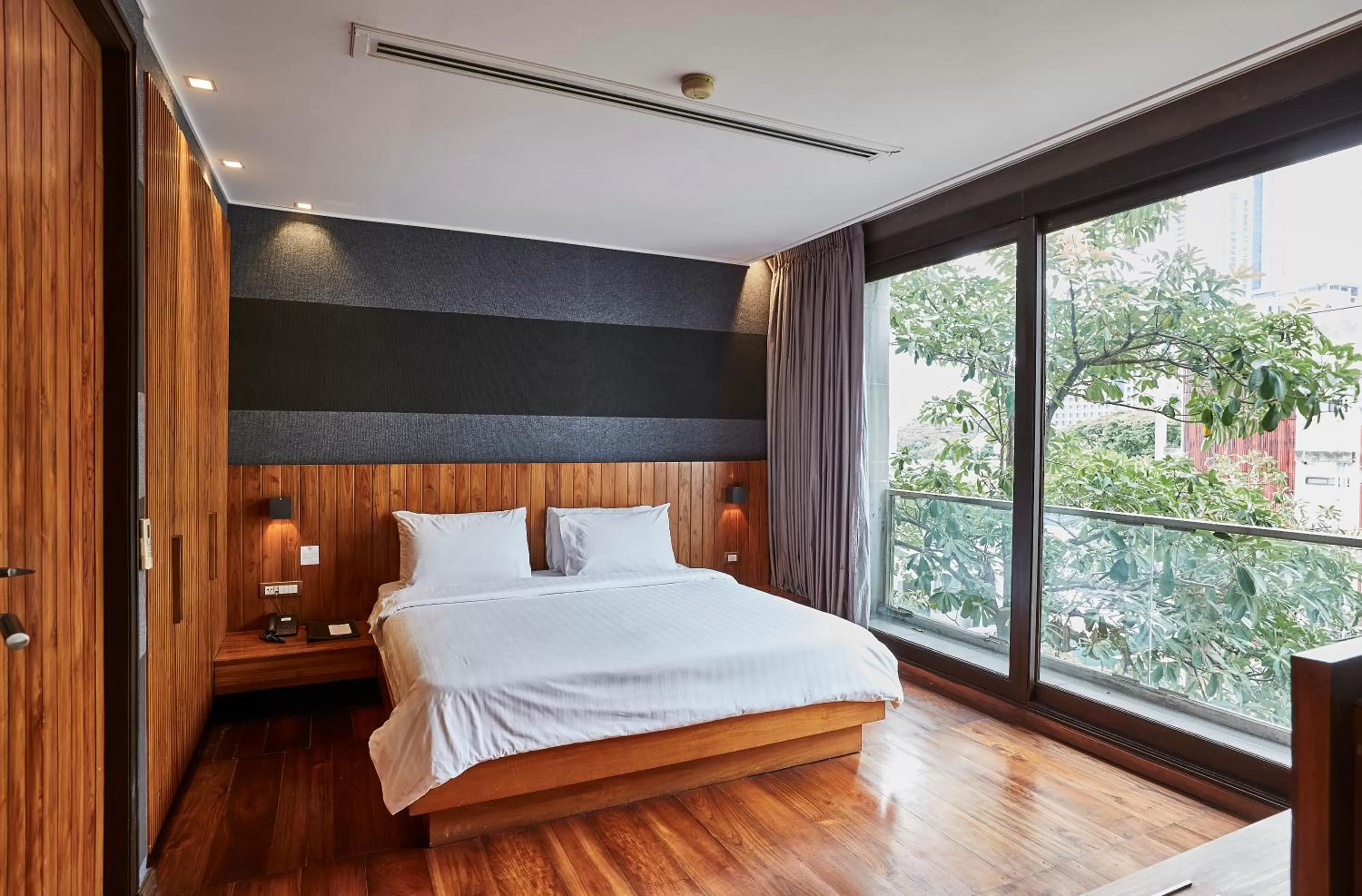 Bed in LUXX Langsuan Hotel - SHA Plus