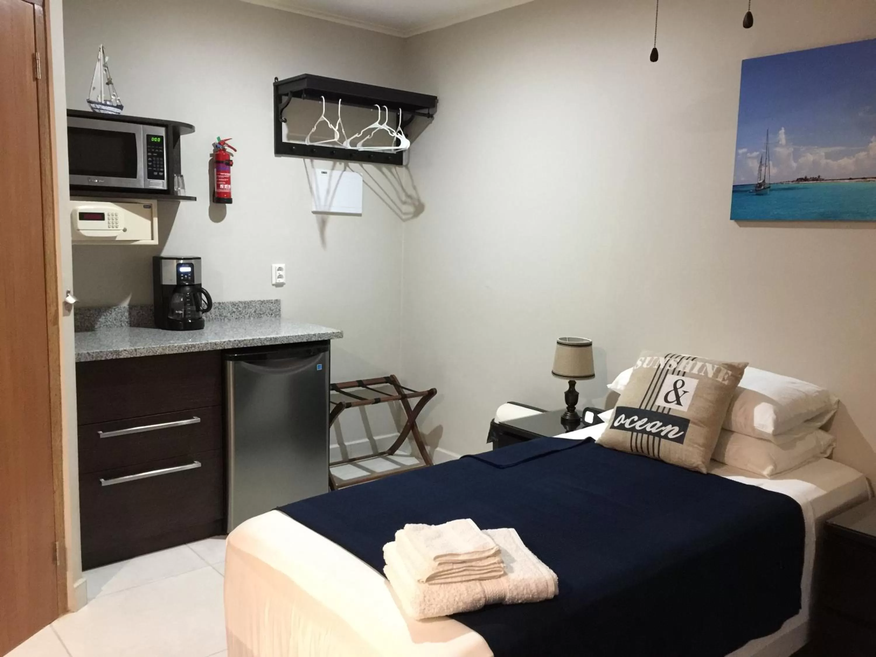 Bed in The Pier Beach Inn & Suites