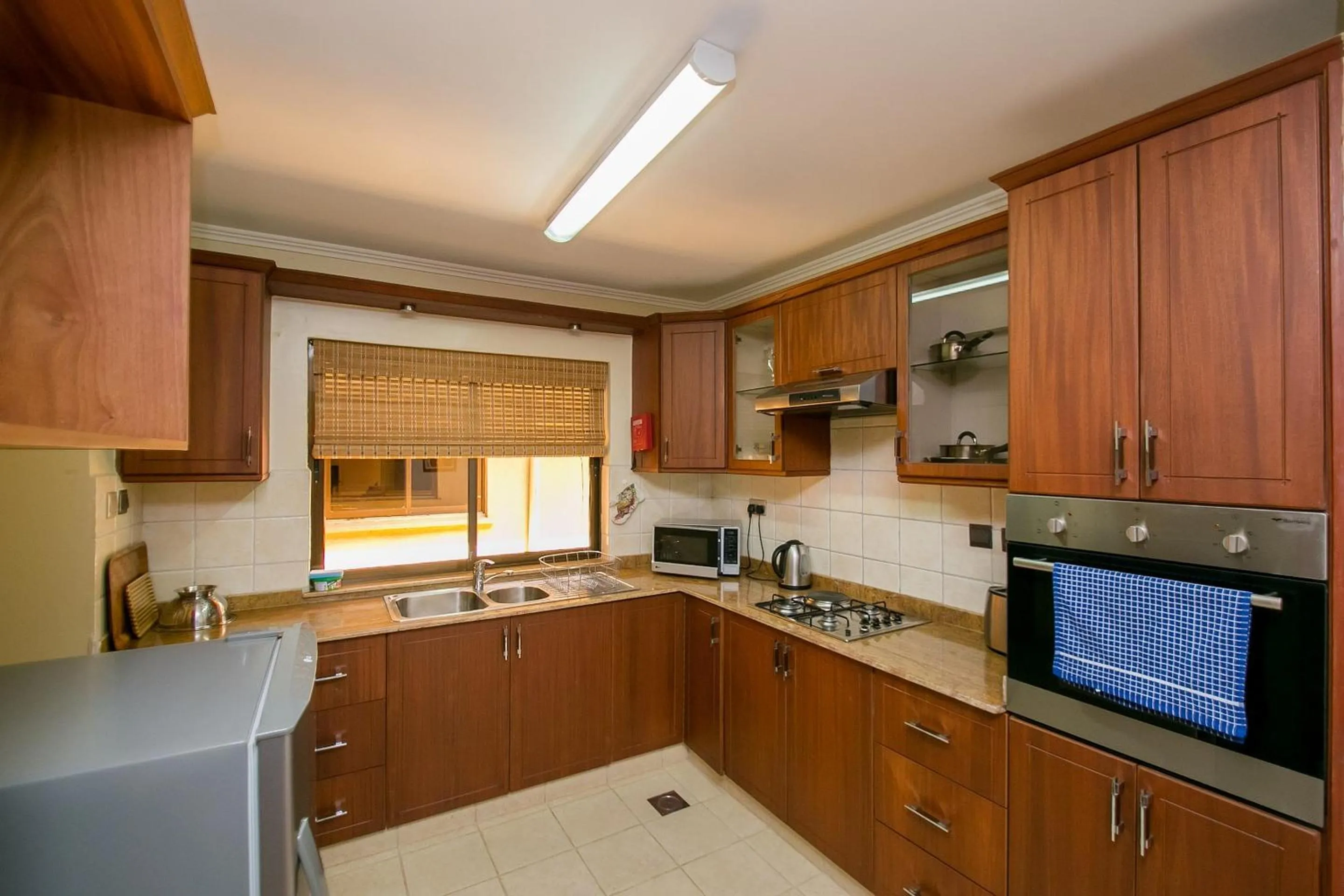 Kitchen or kitchenette in Waridi Paradise Hotel and Suites