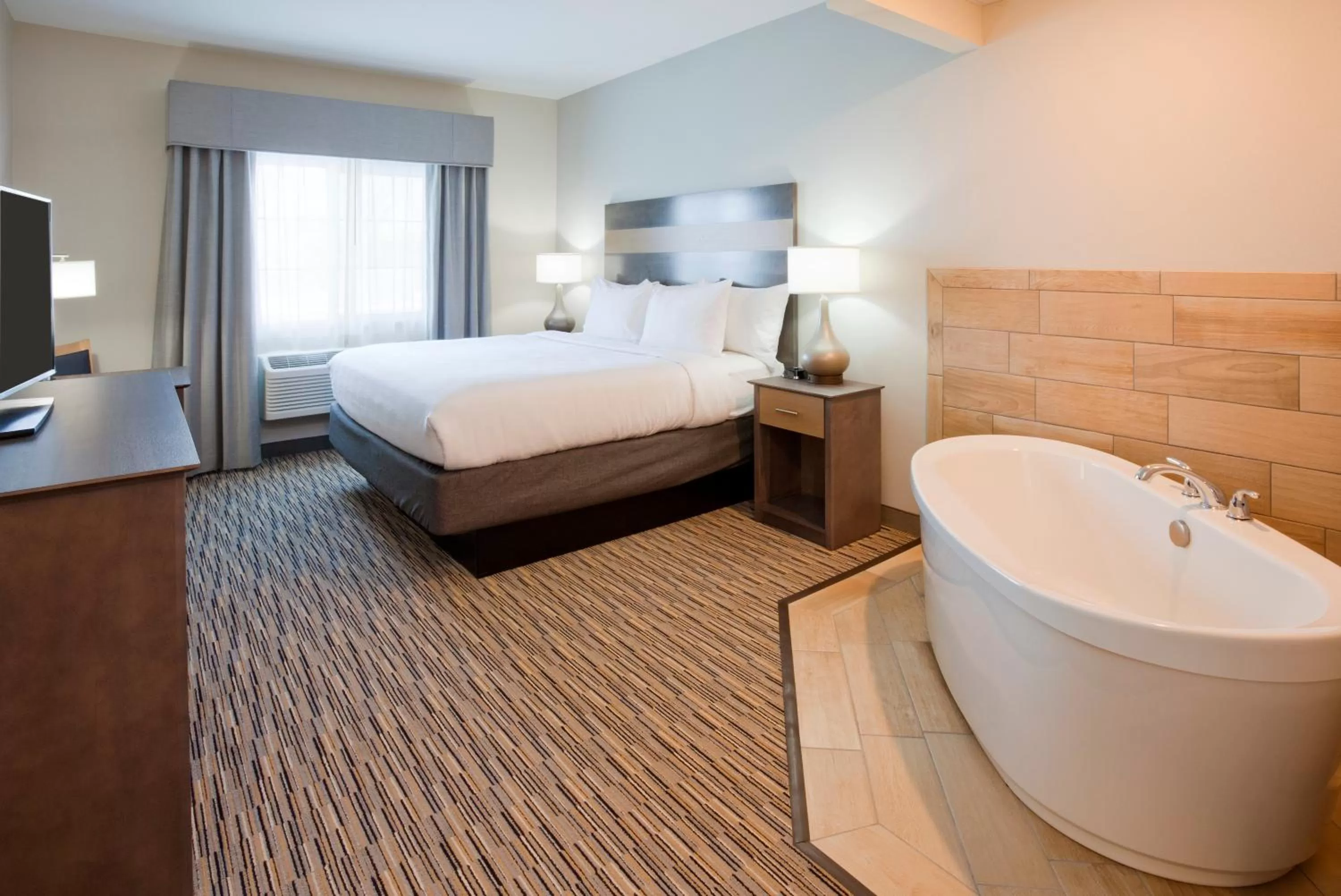 Photo of the whole room, Bed in GrandStay Hotel & Suites