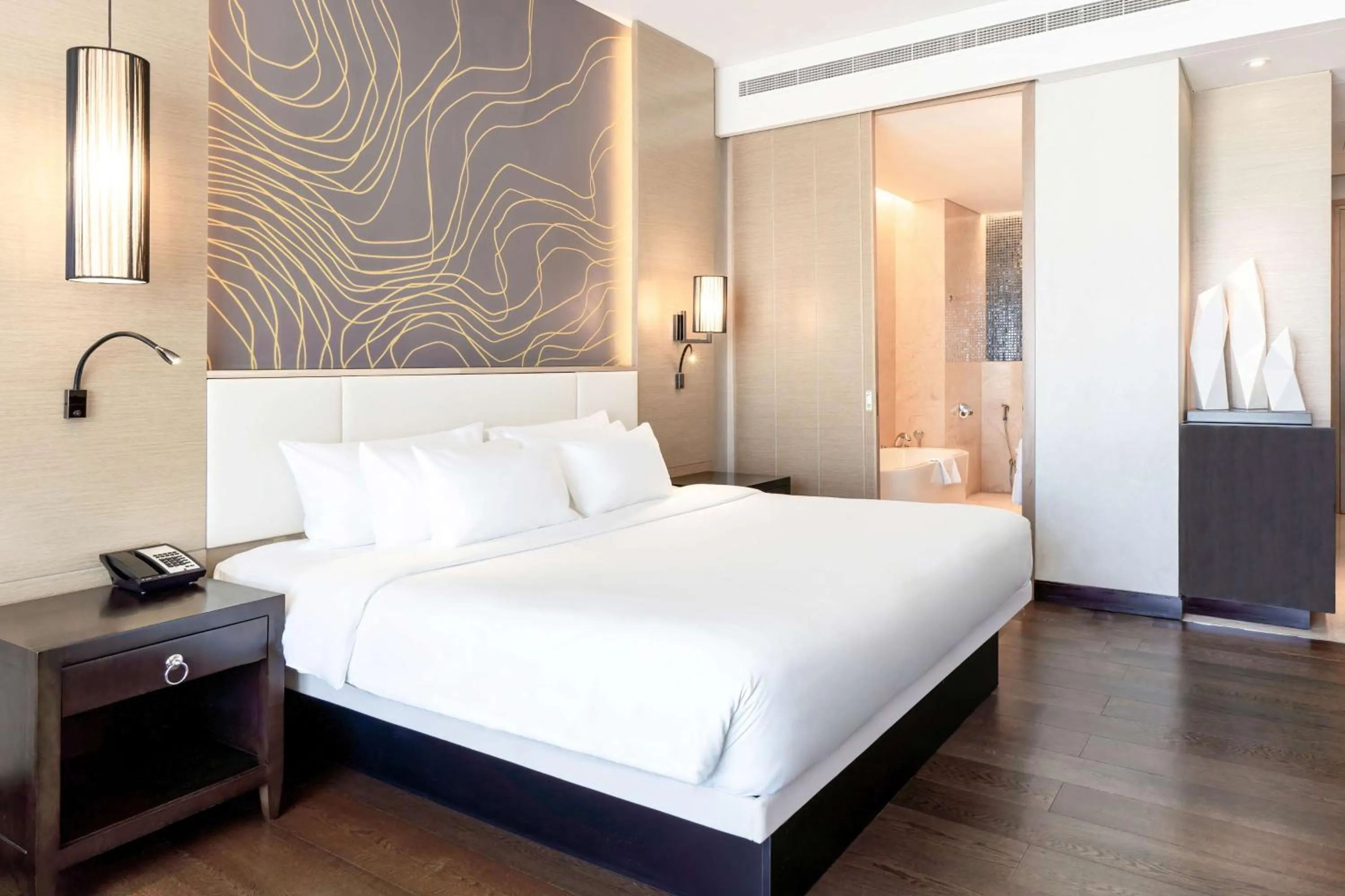 Photo of the whole room, Bed in Radisson Collection Muscat, Hormuz Grand