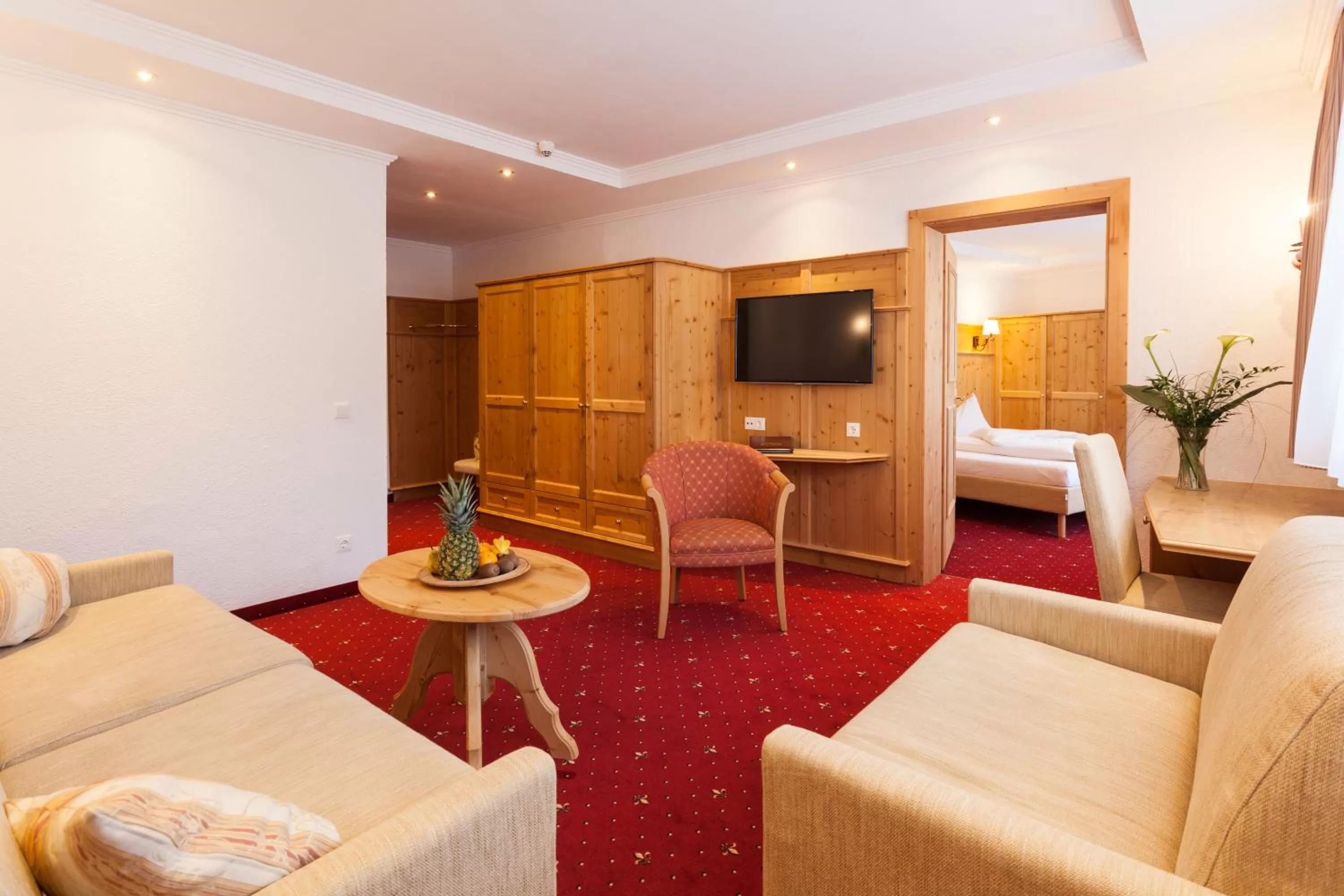 Living room, Bed in Hotel Berghof