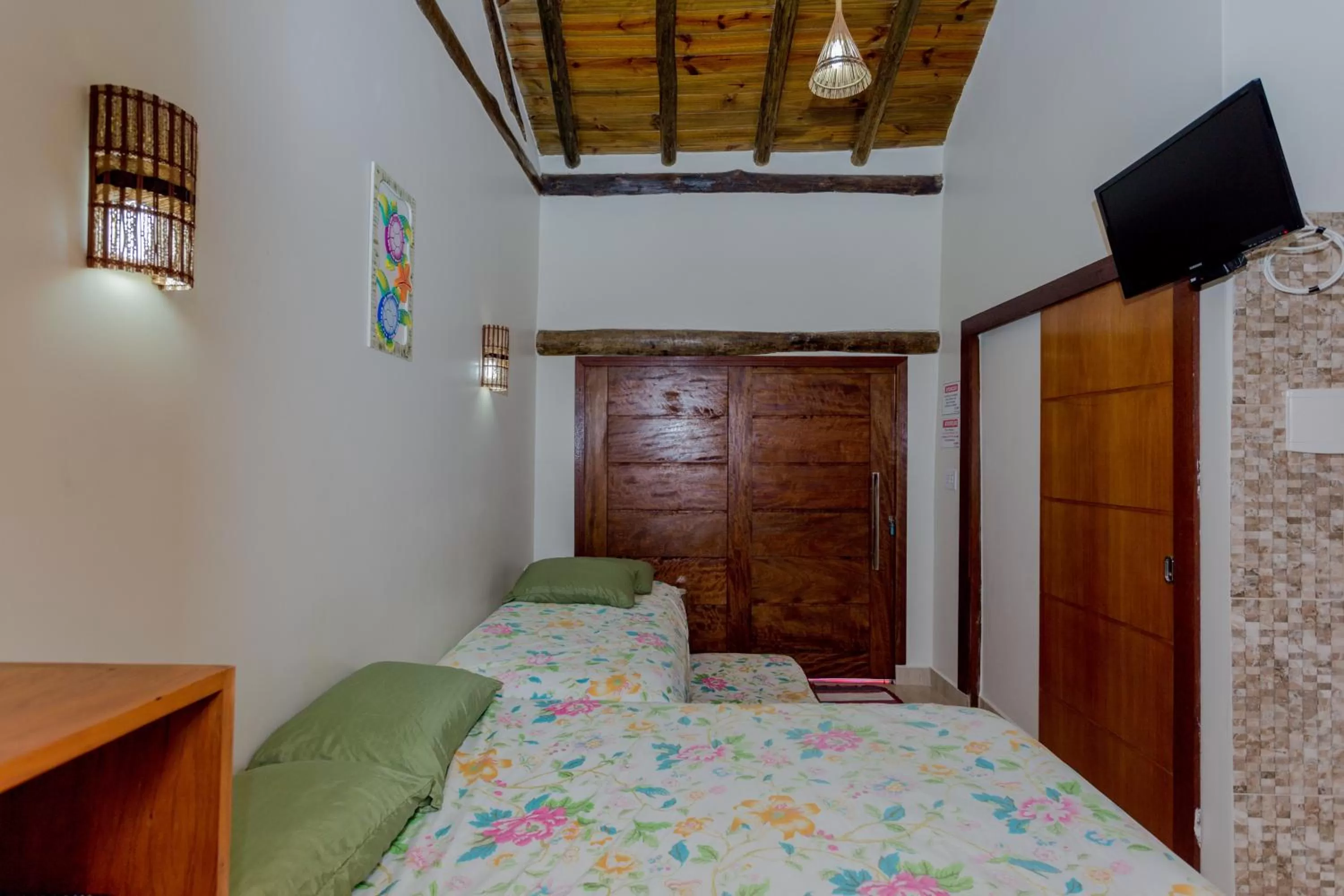 Bed in Pousada Chalés do Julião