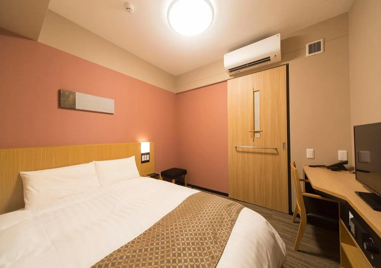 Bed in Dormy Inn Premium Tokyo Kodenmacho