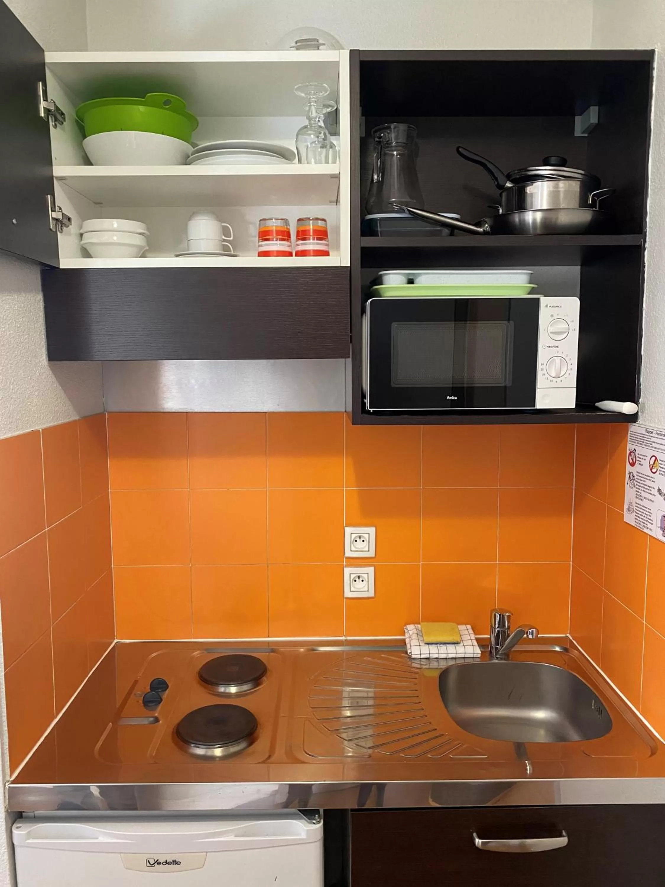 Kitchen or kitchenette in ApartHotel Sainte-Marthe
