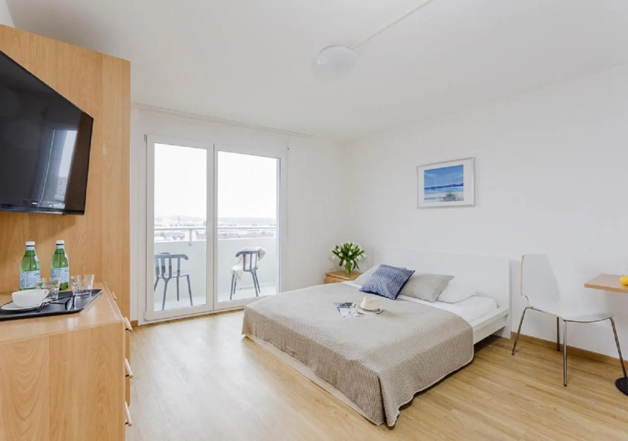 Photo of the whole room, Bed in Swiss Star Tower - Self Check-In