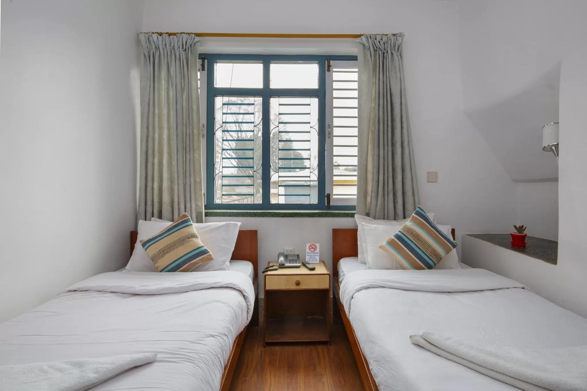 Bed in Pacific Guest House