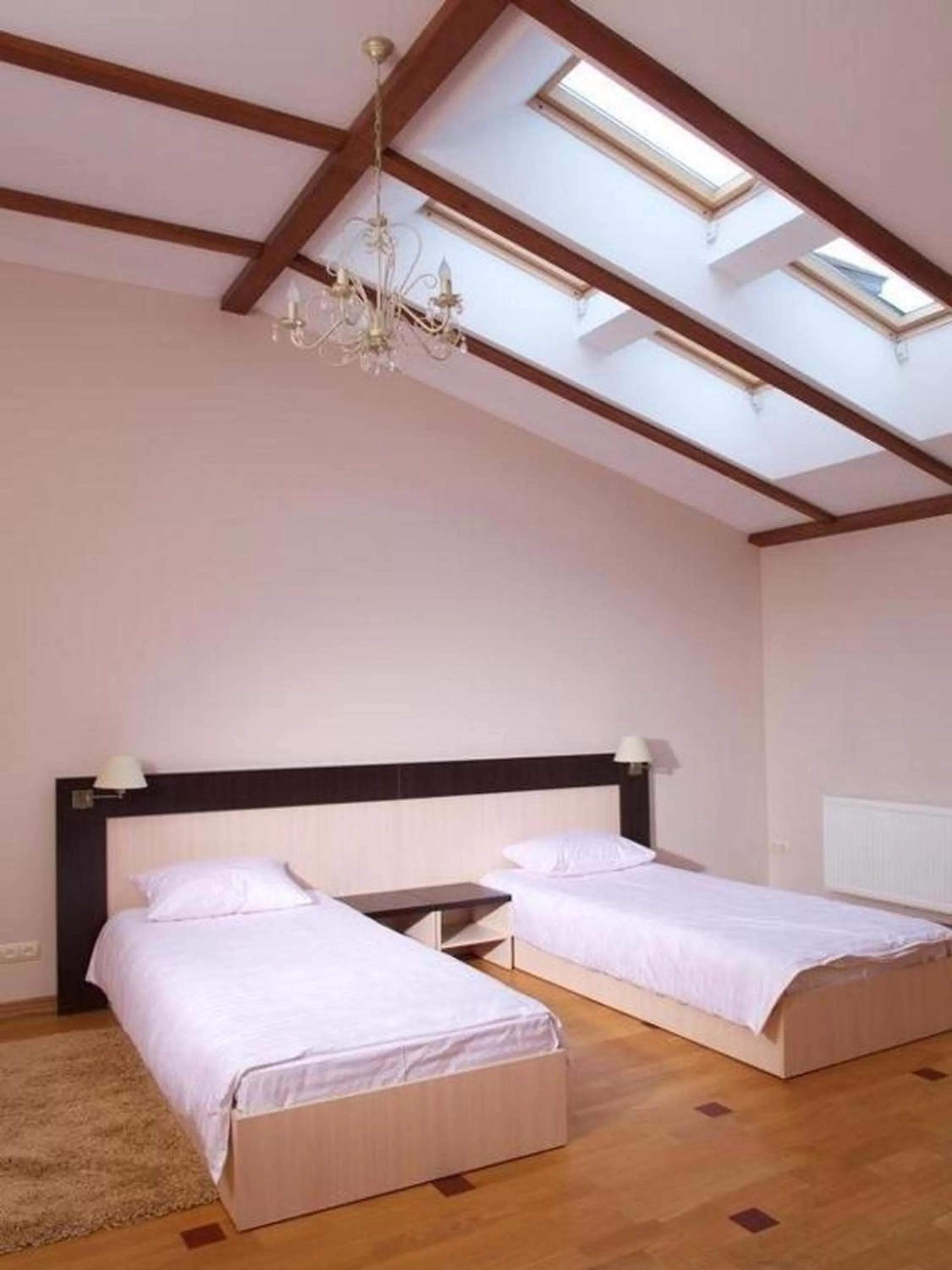 Bed in Mini-Hotel Under The Roof