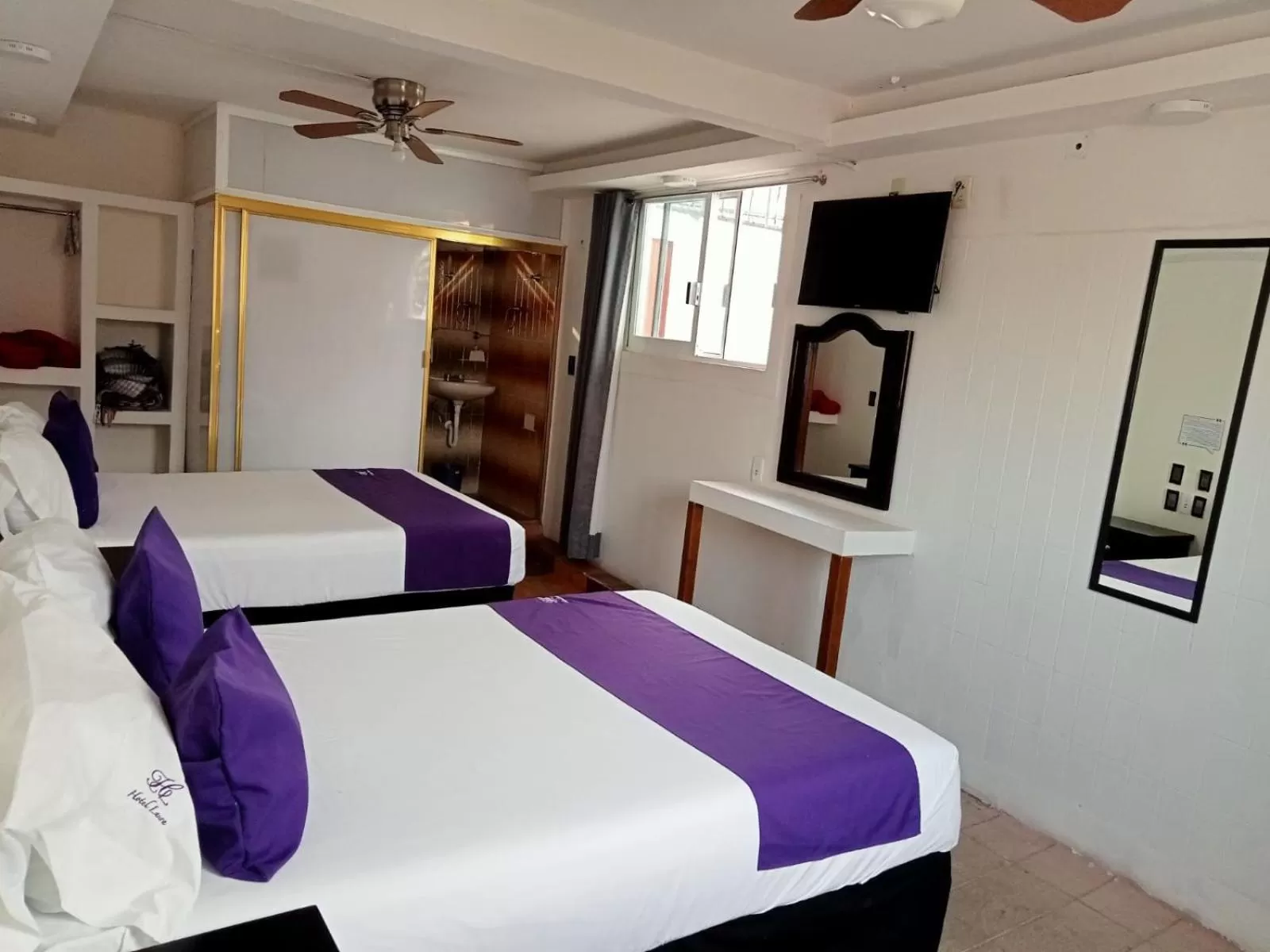 Bed in Hotel Posada Laura