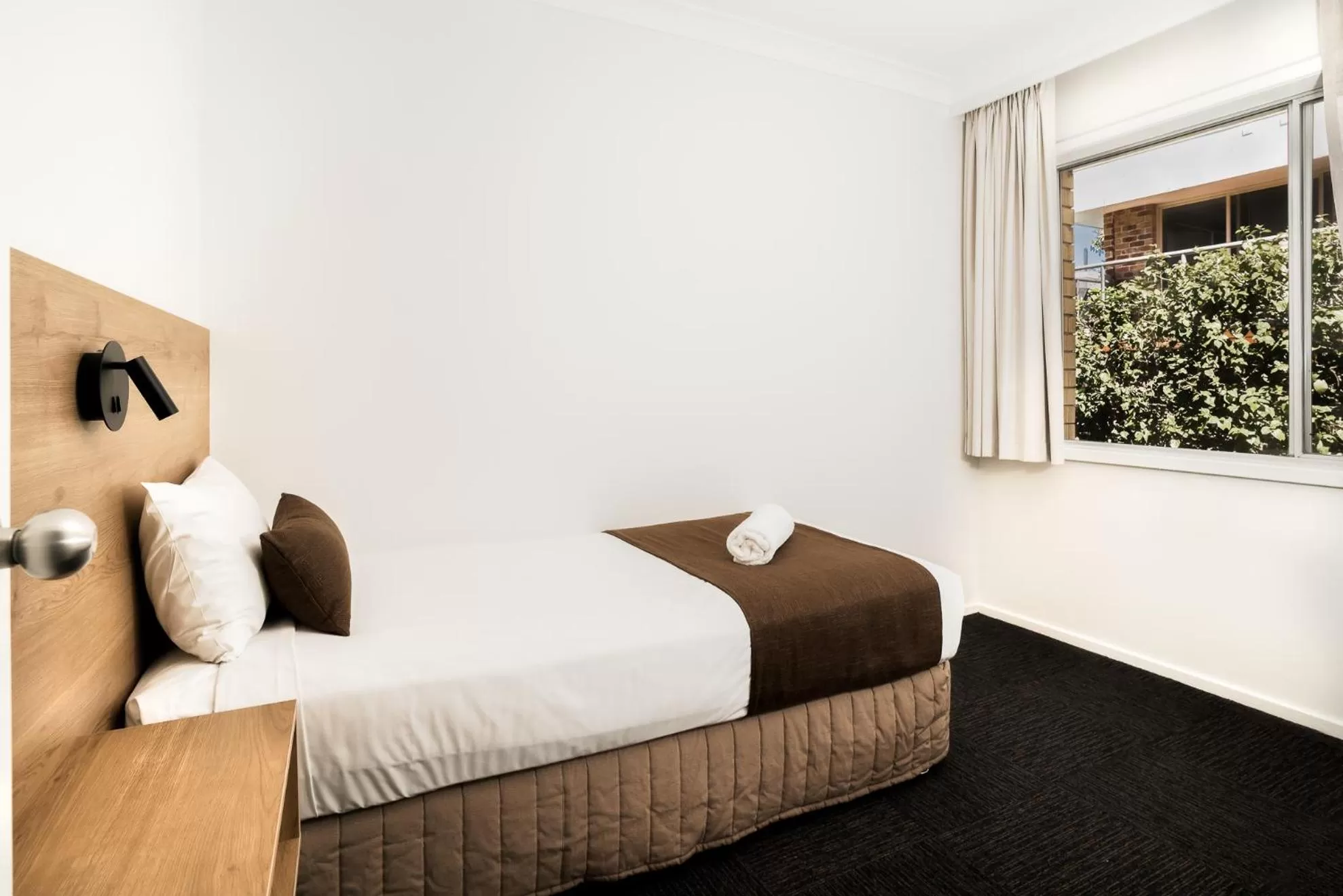 Bed in Caribbean Motel