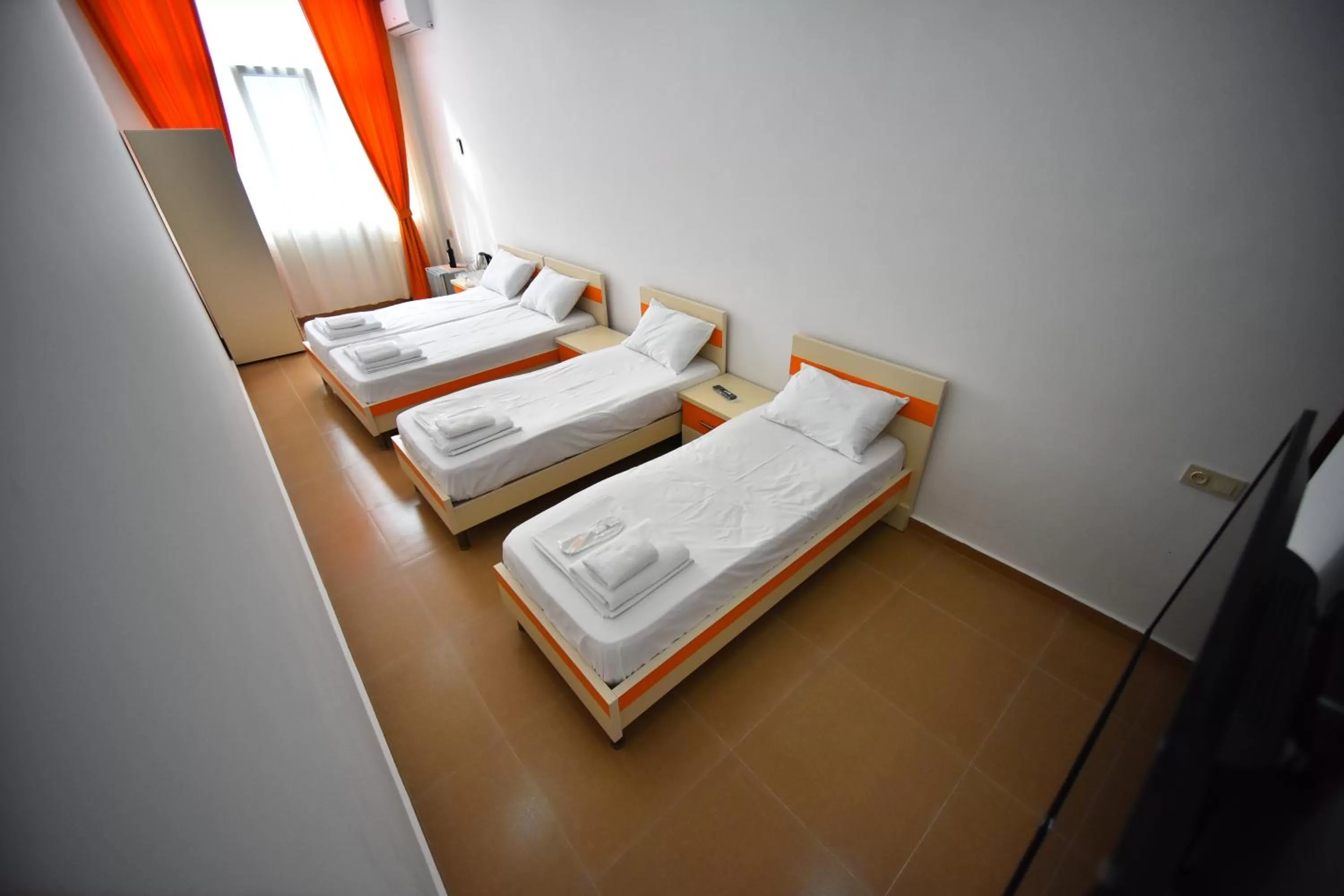 Bed in Orange Home Hotel