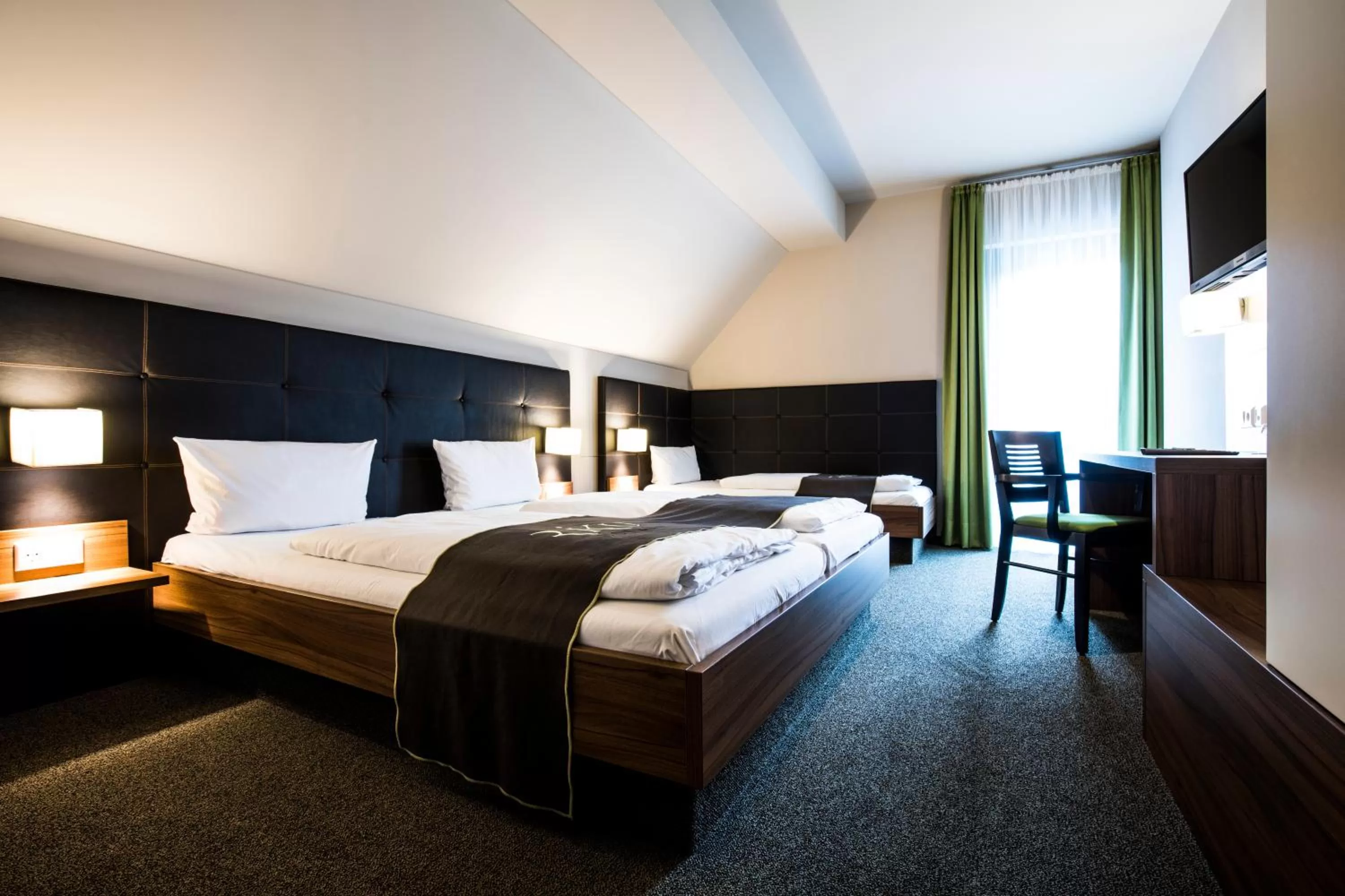 Photo of the whole room, Bed in RiKu HOTEL Weißenhorn