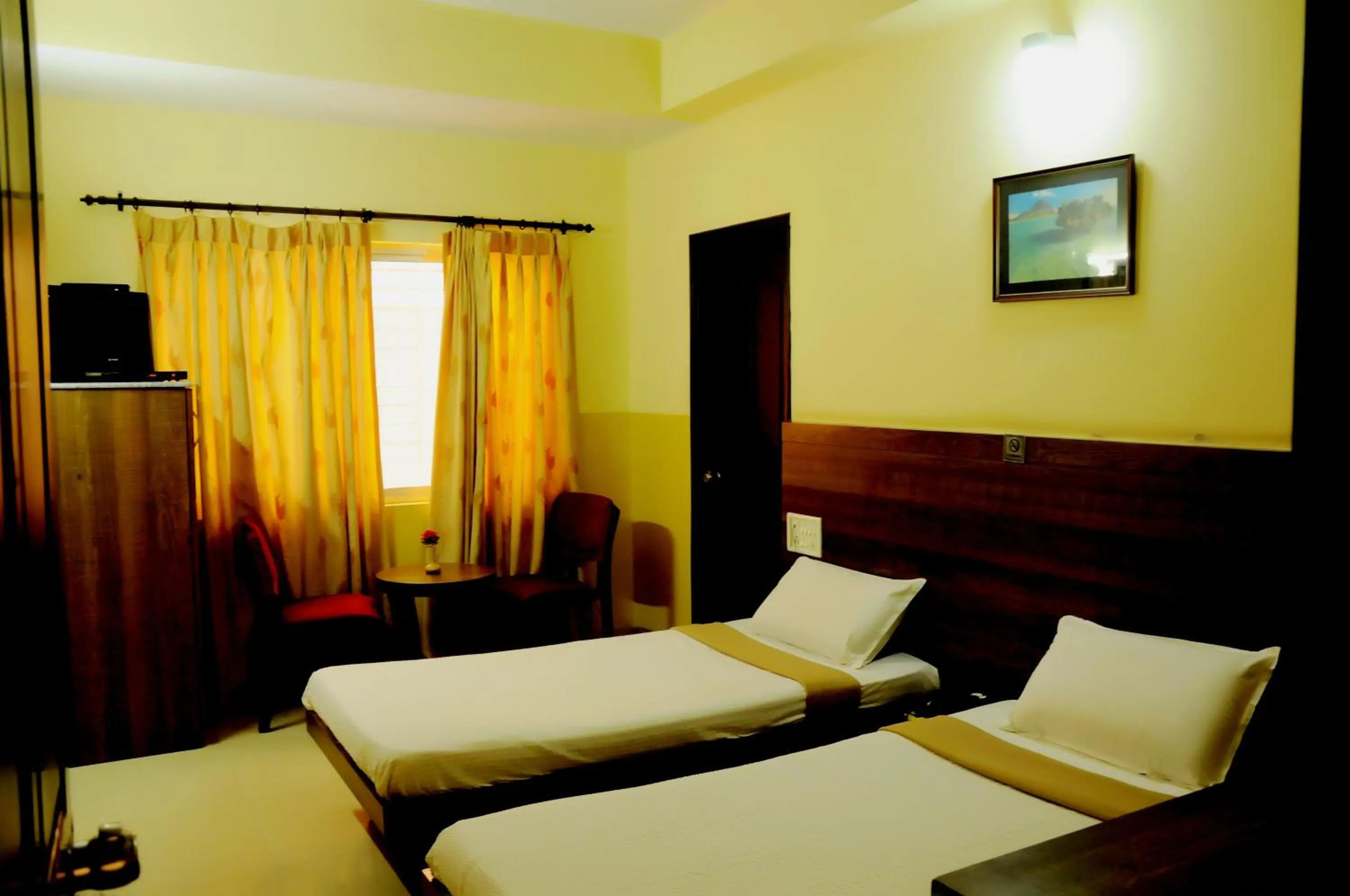 Photo of the whole room, Bed in Suvarna Residency