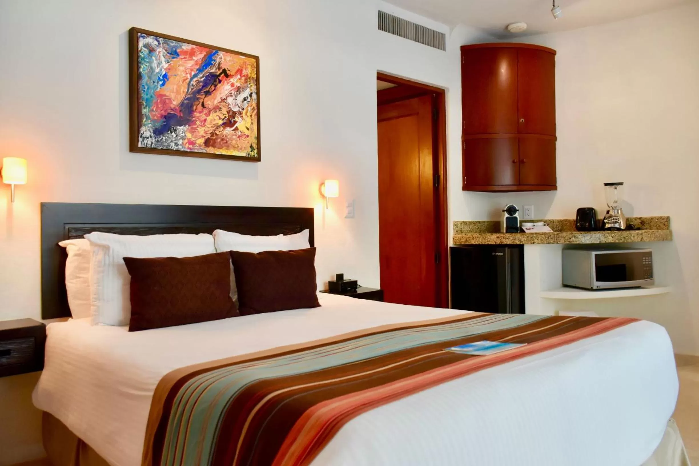 Bed in Playa Palms Beach Hotel