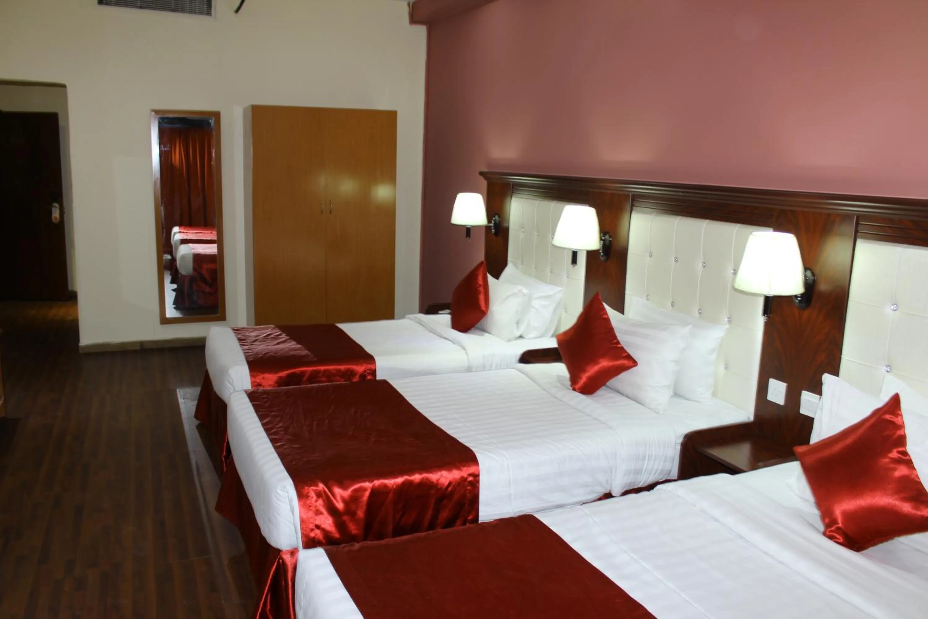 Bed in Grand Nova Hotel