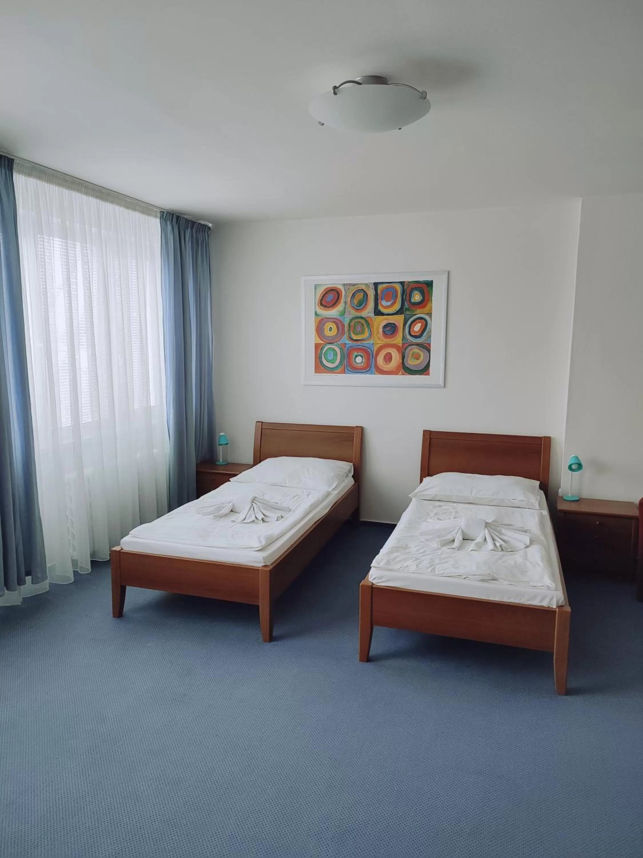 Bed in BEST Hotel Garni