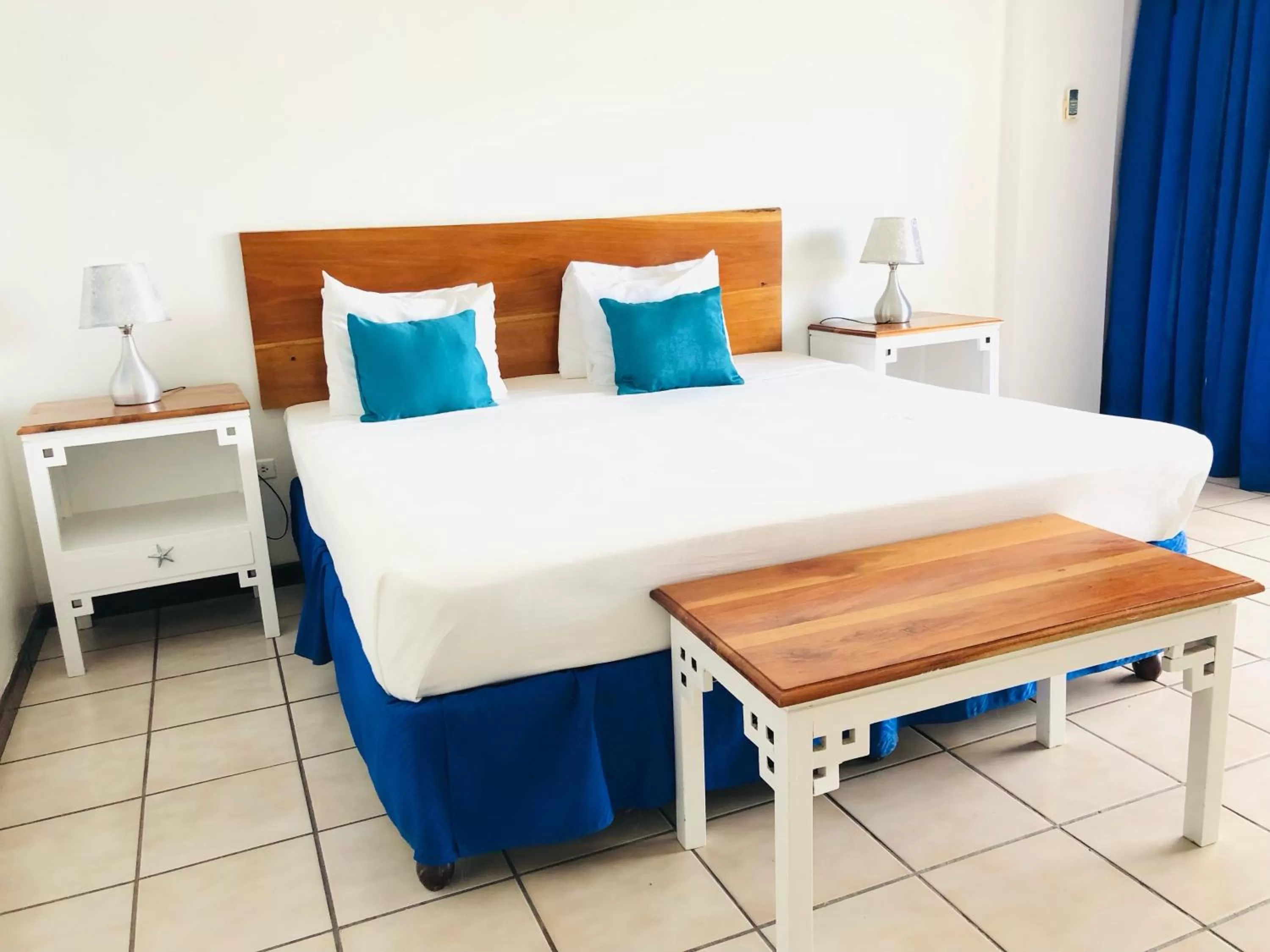 Bedroom, Bed in Sand and Tan Beach Hotel