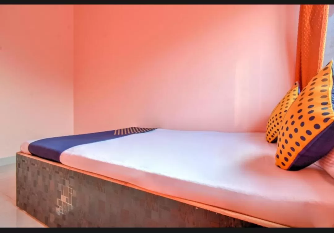 Bed in Hotel Nisarg Lodging And Restaurant