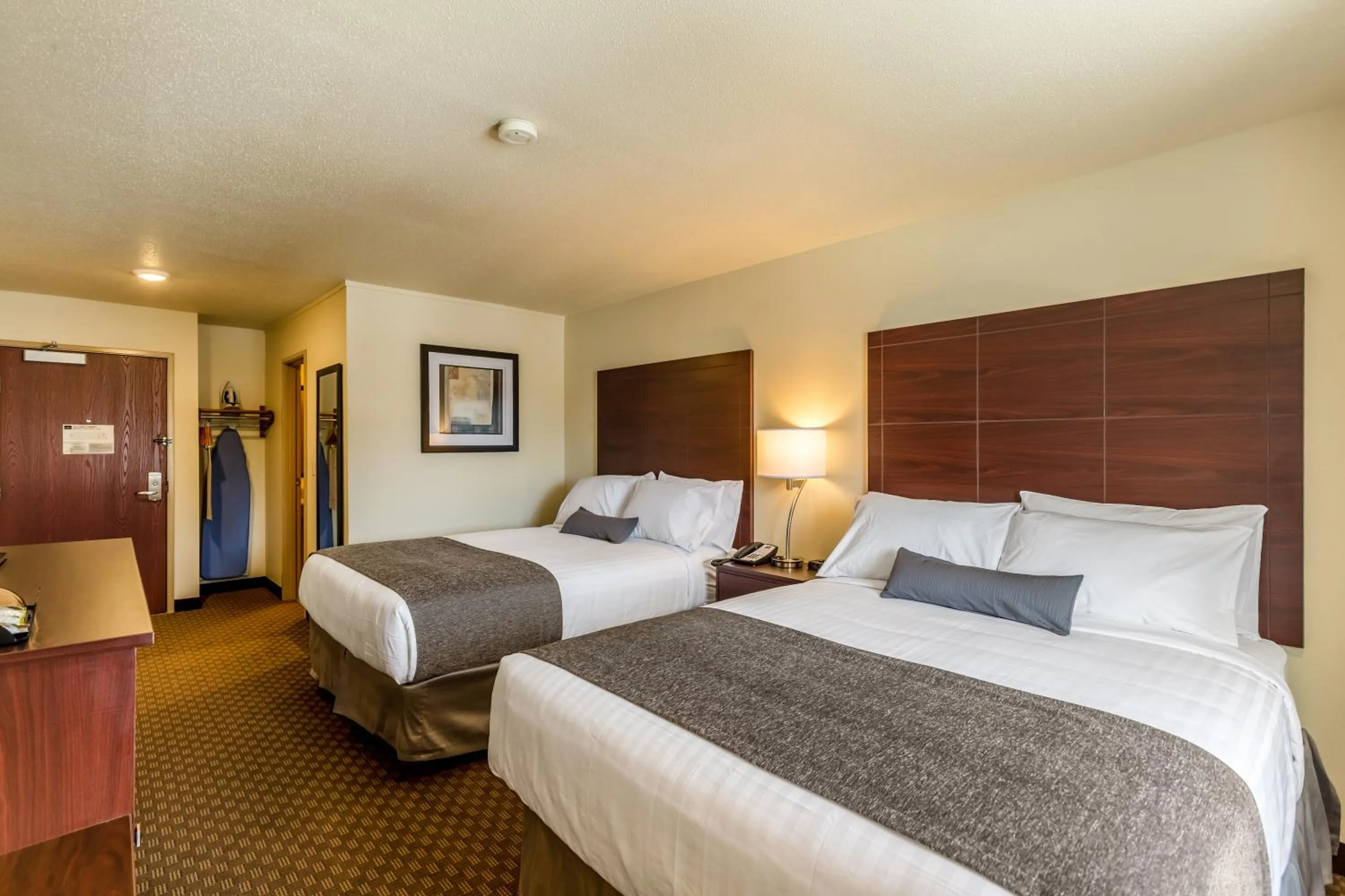 Bed in Cobblestone Inn & Suites - Merrill