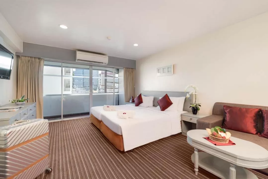 Photo of the whole room, Bed in Furama Silom Hotel