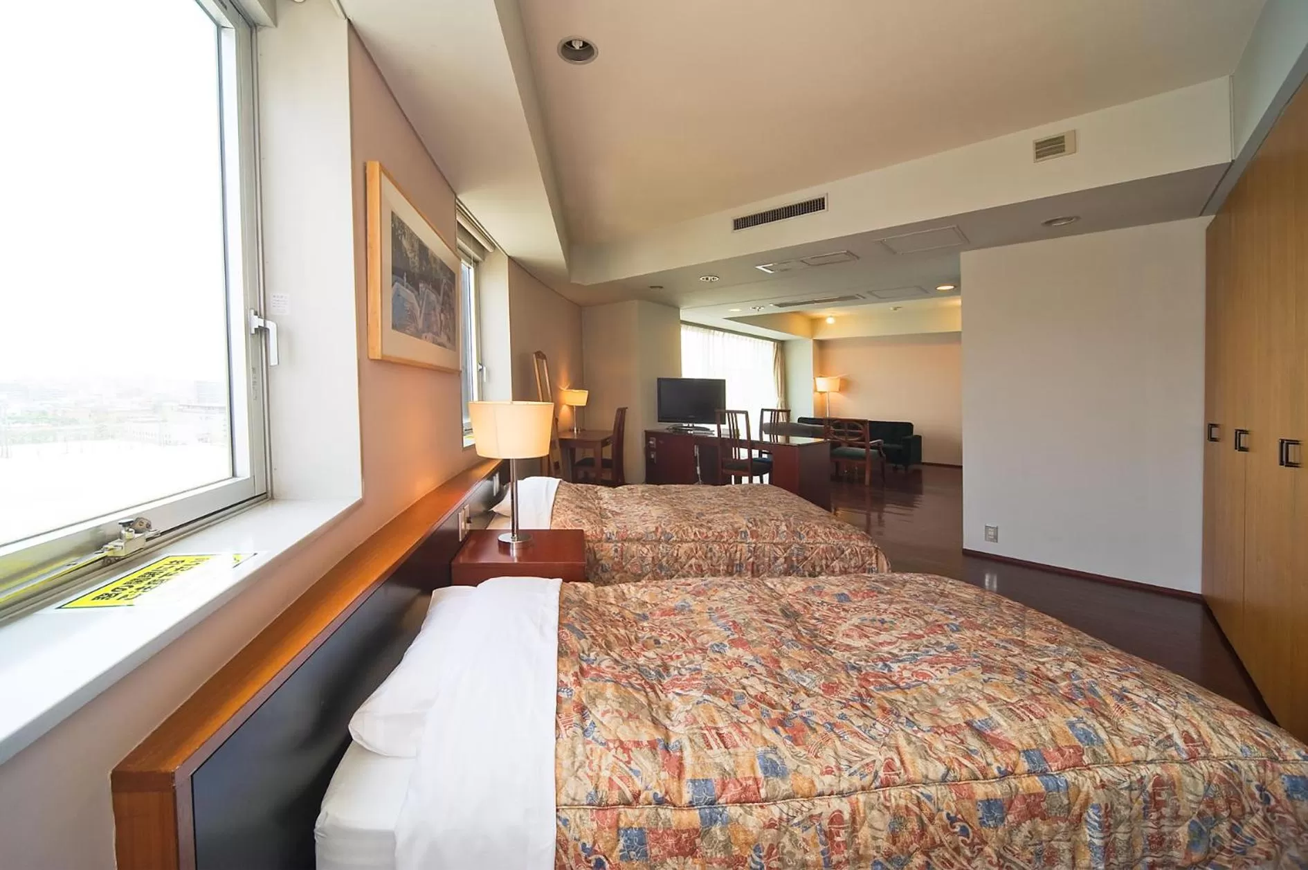 Living room, Bed in The Residential Suites Fukuoka