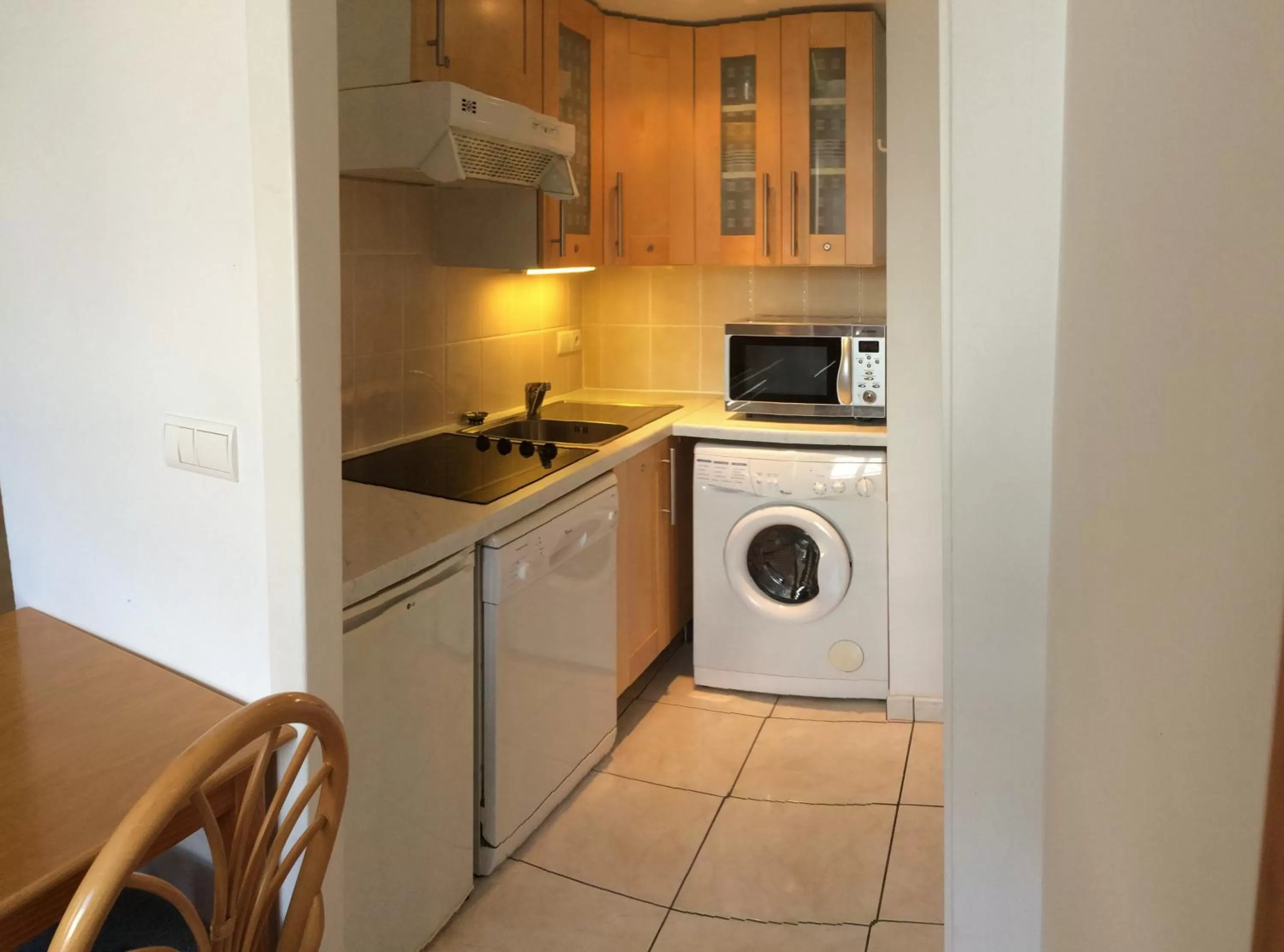 Kitchen or kitchenette in Hôtel & Appart-hôtel Olatua