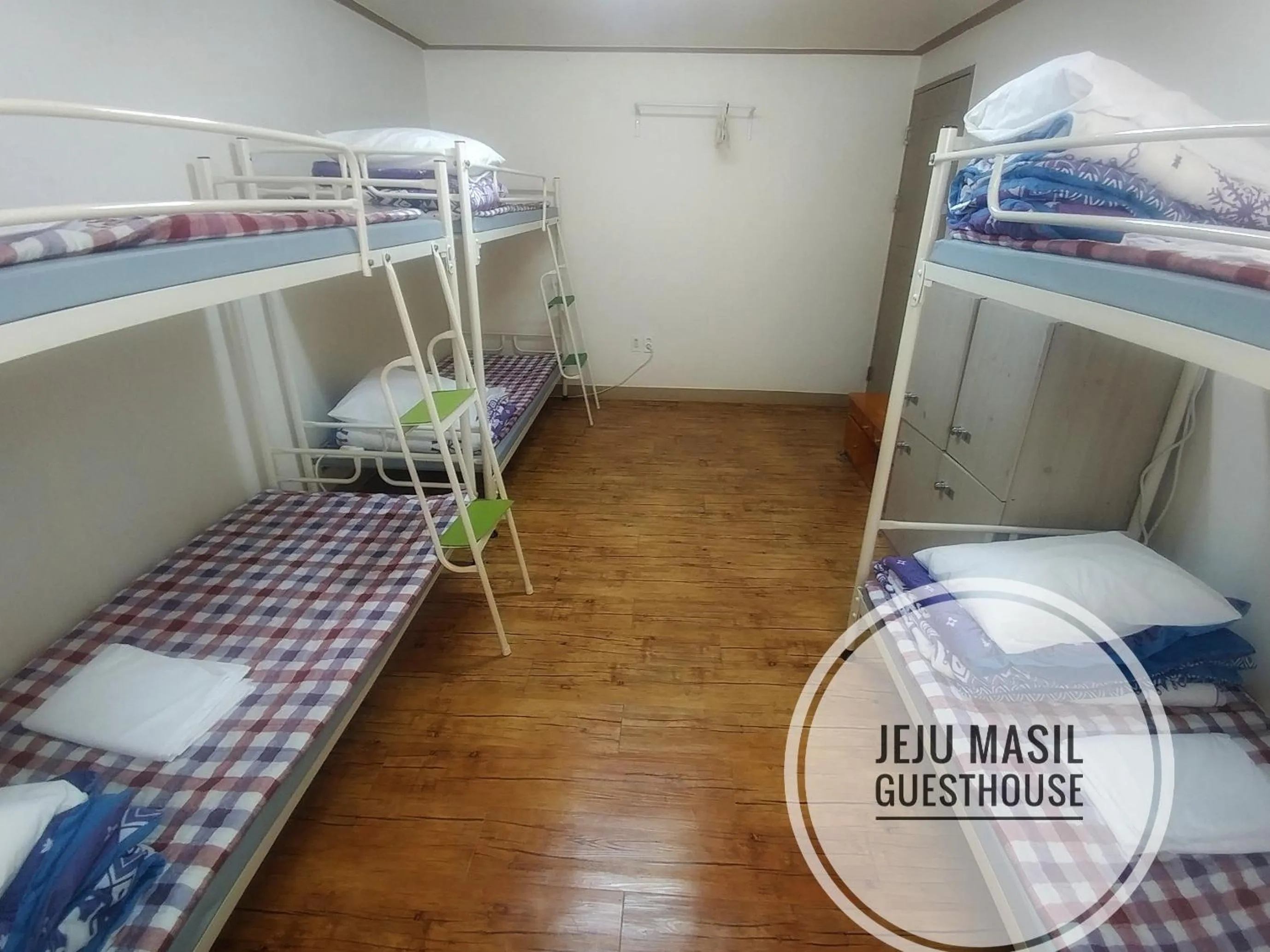 Bed in Jeju Masil Guesthouse