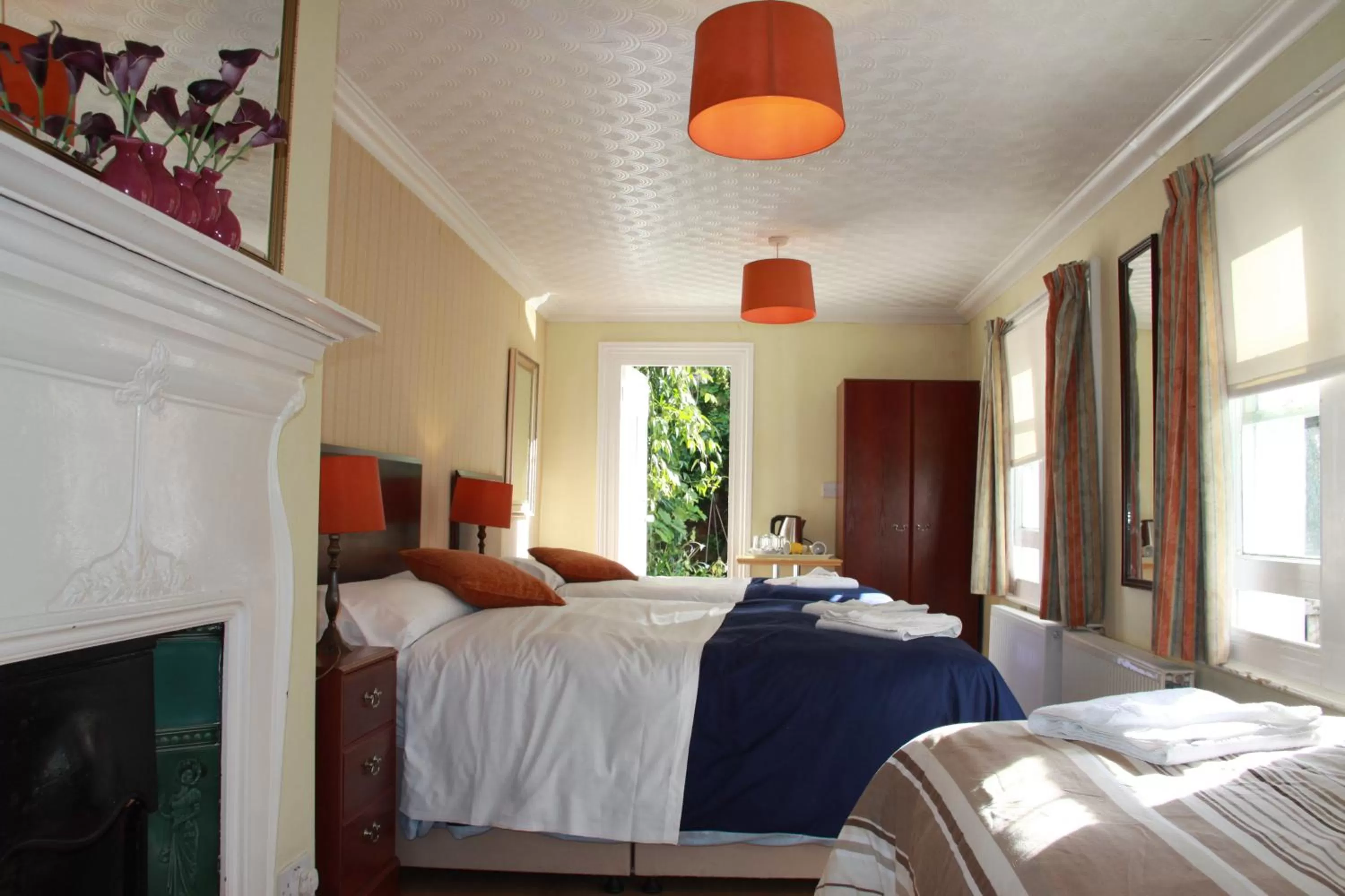 Bed in Ambassador Hotel