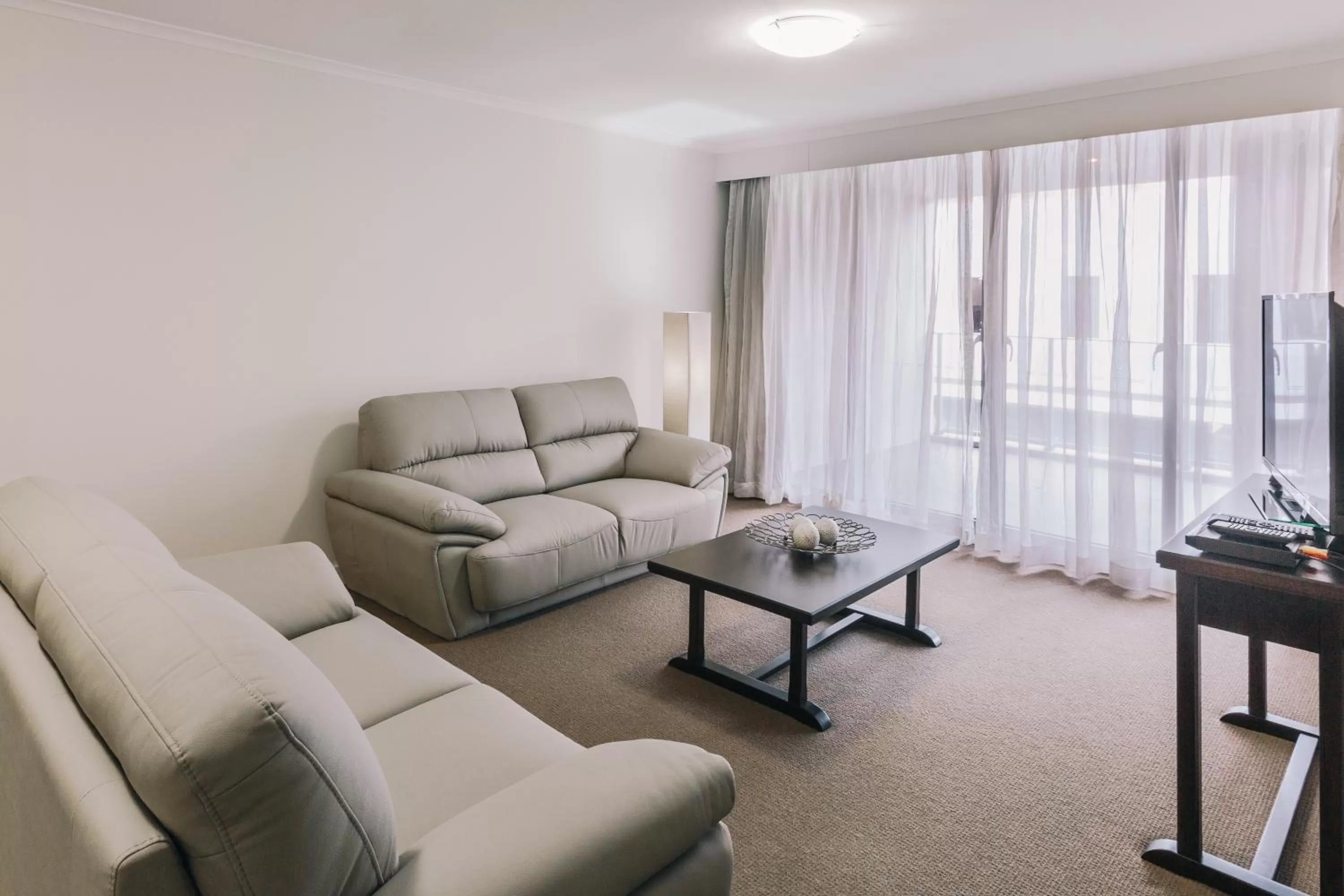Living room in Newcastle Central Plaza Apartment Hotel Official