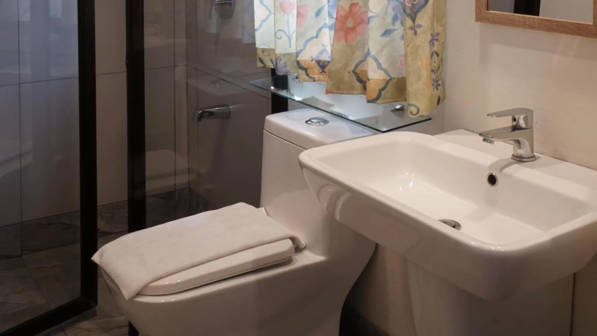 Toilet in 1775 Adriatico Suites